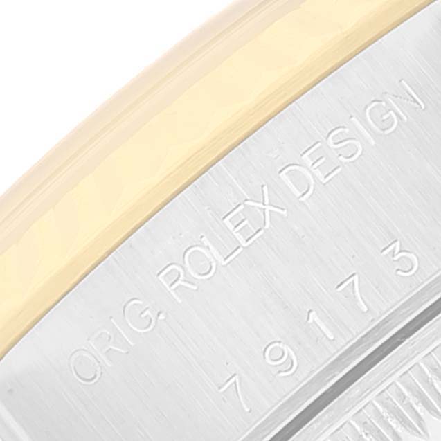 This image shows a close-up view of the engraving on the case back of a Rolex Datejust 79163 Women's Steel and Gold (two tone) White Dial 79163 Women's Steel and Gold (two tone) White Dial watch.