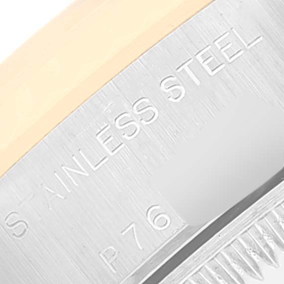 The image shows a close-up of the side and edge of a stainless steel Rolex Datejust 79163 Women's Steel and Gold (two tone) White Dial 79163 Women's Steel and Gold (two tone) White Dial watch.