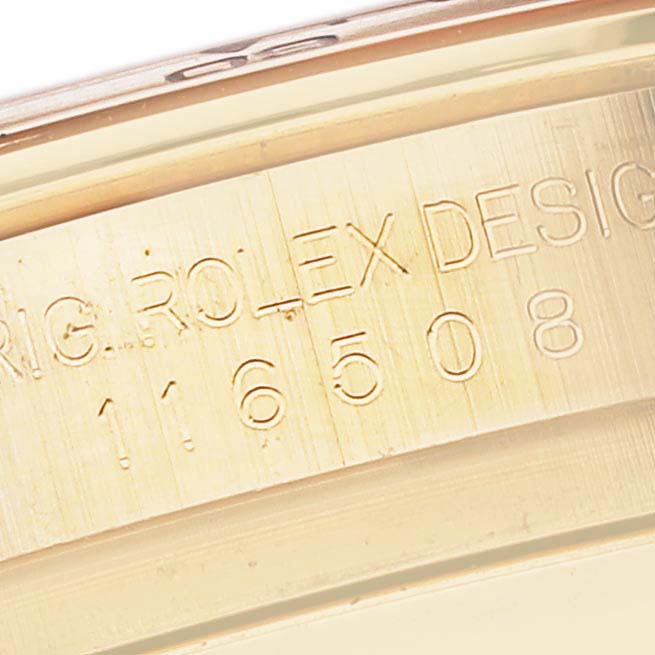 This close-up image shows the engraved inner bezel of a Rolex Daytona 116508 Men's Yellow Gold Green Dial 116508 Men's Yellow Gold Green Dial watch displaying its model number.