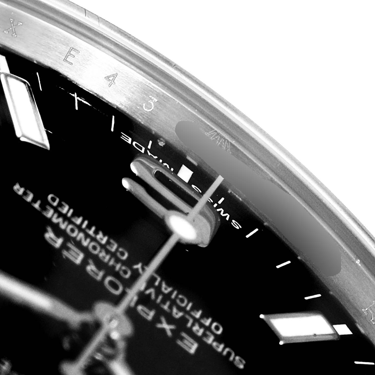 The image shows a close-up, angled view of the dial and bezel of a Rolex Explorer 214270 Men
s Stainless Steel Black Dial 214270 Men
s Stainless Steel Black Dial watch, highlighting the markers and text.