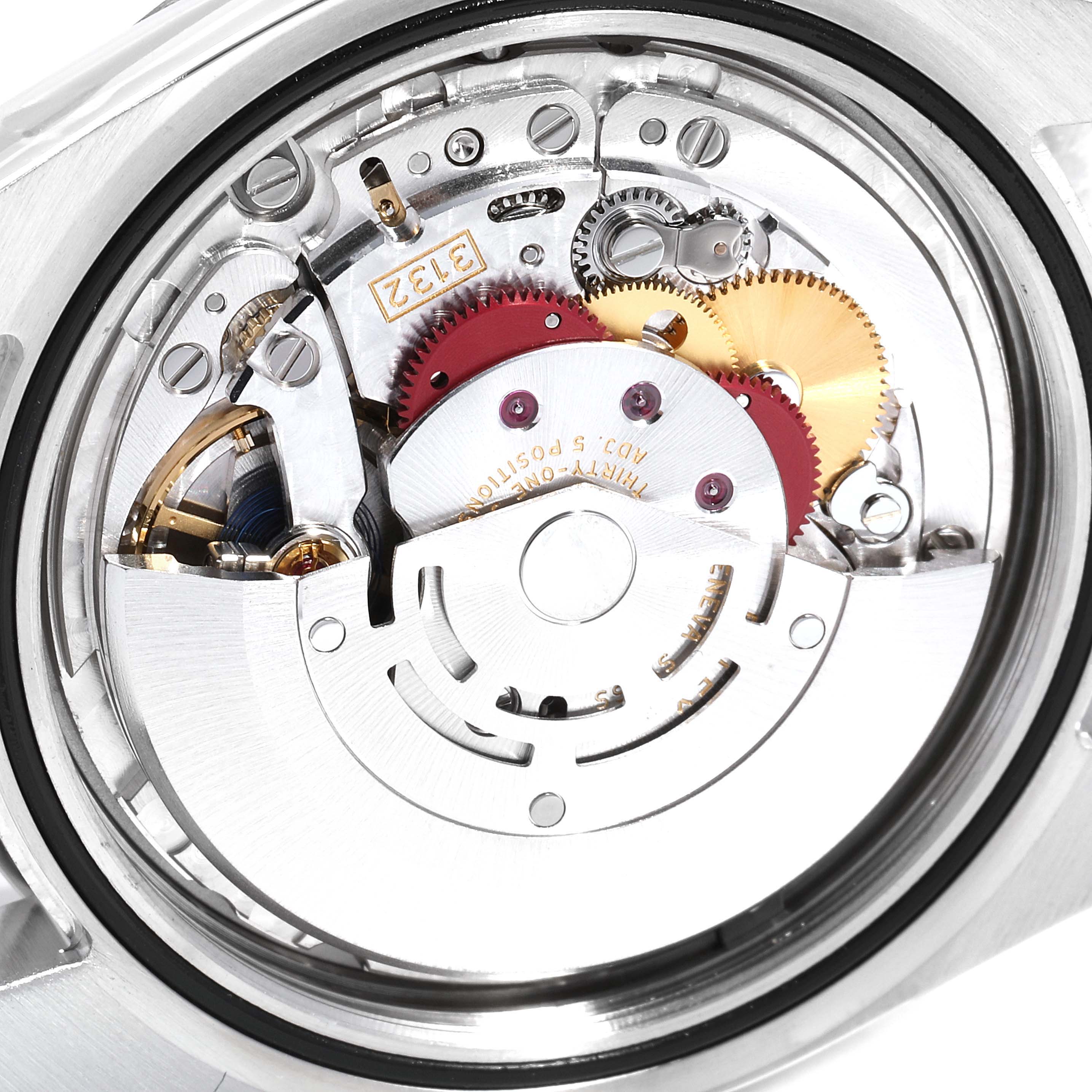 The image shows a close-up of the movement mechanism of a Rolex Explorer 214270 Men
s Stainless Steel Black Dial 214270 Men
s Stainless Steel Black Dial watch.