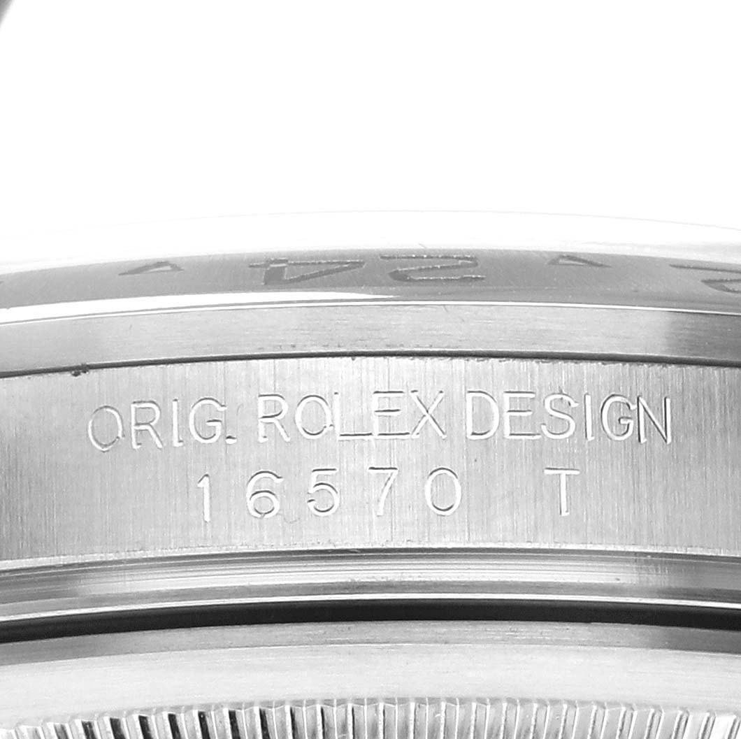This image shows a detailed close-up of the side engraving on a Rolex Explorer 16570 Men
s Stainless Steel Black Dial 16570 Men
s Stainless Steel Black Dial model watch, featuring the text "ORIG. ROLEX DESIGN 16570 T."