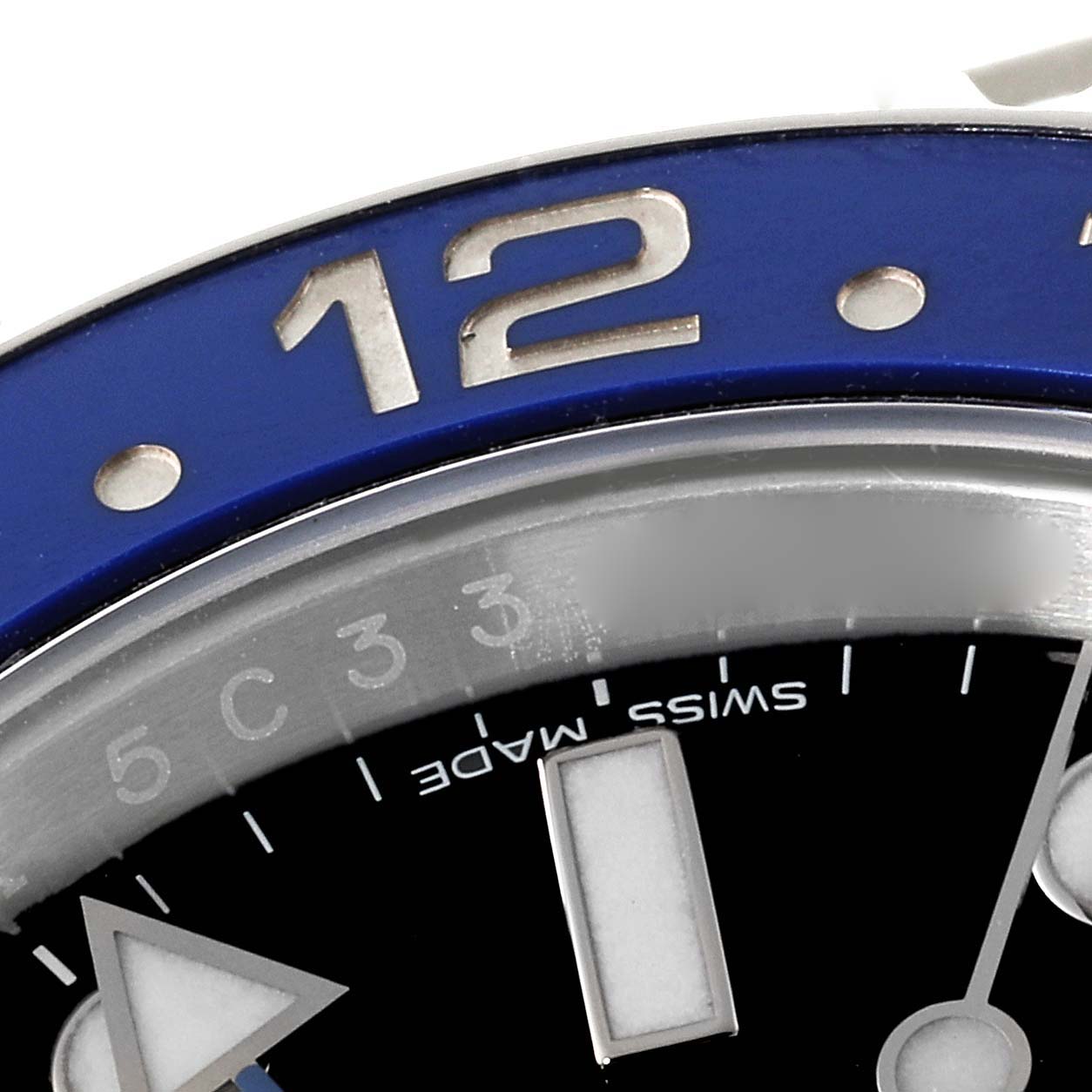 This close-up angle shows the bezel and a portion of the dial of the Rolex GMT-Master 116710 Men's Stainless Steel Black Dial 116710 Men's Stainless Steel Black Dial watch, highlighting the "12" marker.