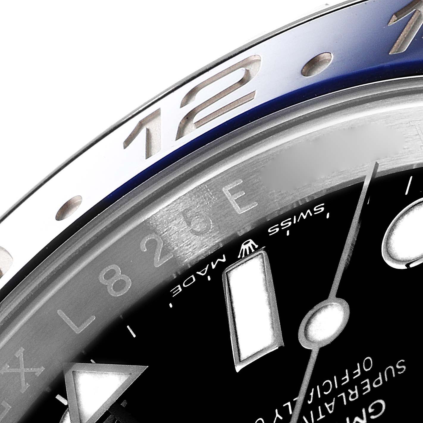 This close-up image shows the bezel and part of the dial of a Rolex GMT-Master 126710 Men
s Stainless Steel Black Dial 126710 Men
s Stainless Steel Black Dial watch.