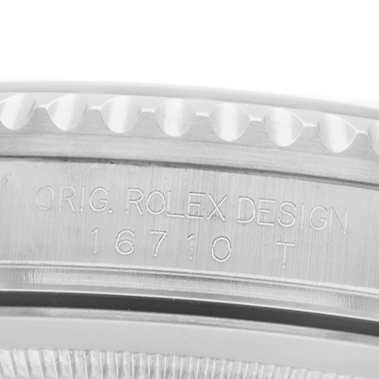 The image shows a close-up of the case side of a Rolex GMT-Master 16710 Men
s Stainless Steel Black Dial, highlighting the engraved model number "16710 T" and "ORIG. ROLEX DESIGN."
