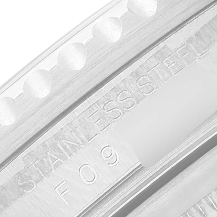 This close-up image shows the stainless steel engravings on the bezel and case of a Rolex GMT-Master 16710 Men
s Stainless Steel Black Dial 16710 Men
s Stainless Steel Black Dial watch.