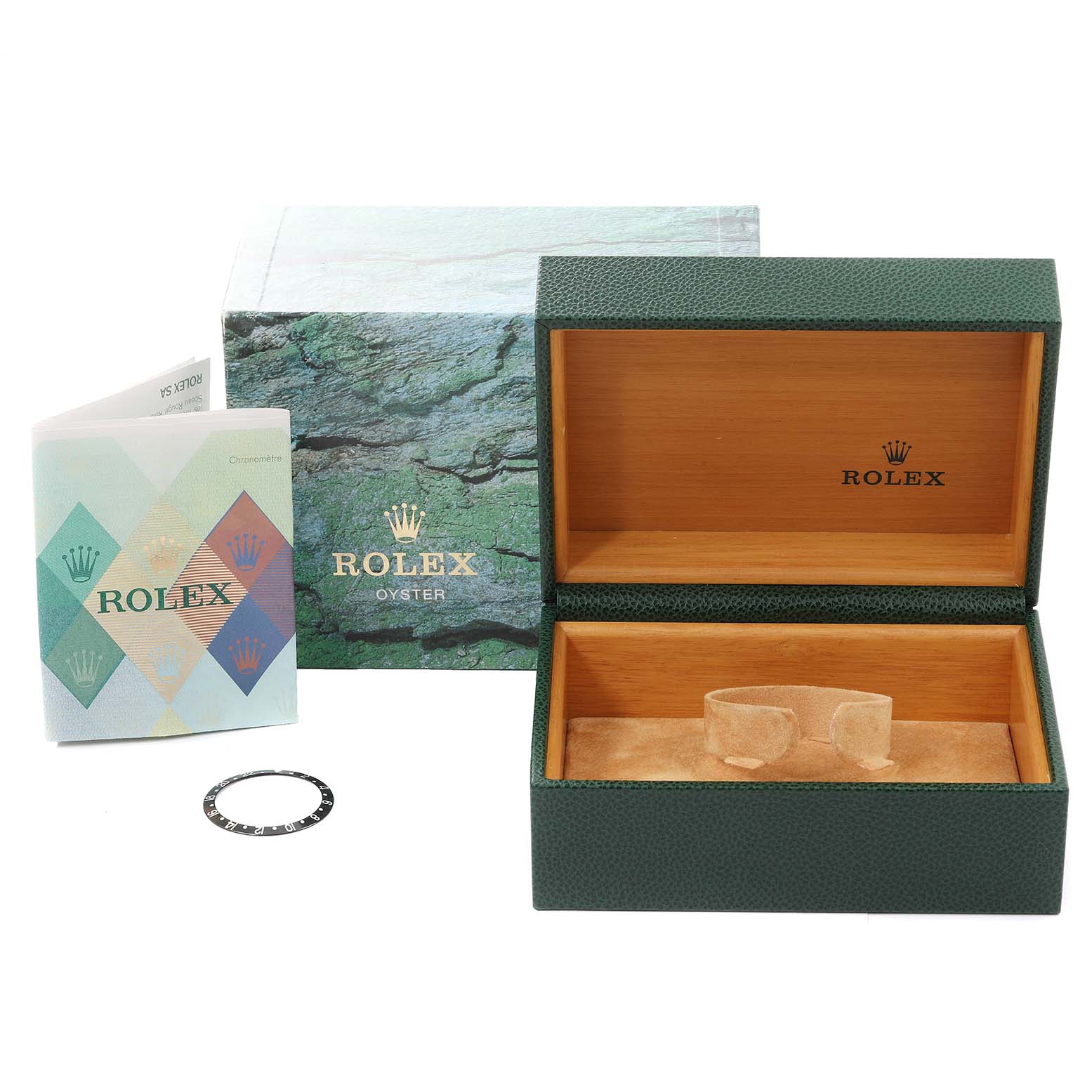 The image shows a Rolex GMT-Master 16710 Men
s Stainless Steel Black Dial 16710 Men
s Stainless Steel Black Dial watch box with an open lid, paperwork, and a separate watch bezel.