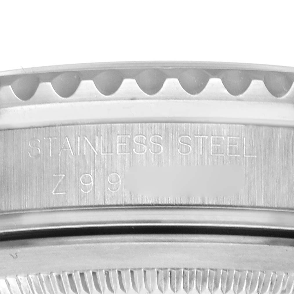This image shows a close-up of the side of the stainless steel case of a Rolex GMT-Master 16710 Men's Stainless Steel Black Dial 16710 Men's Stainless Steel Black Dial watch.