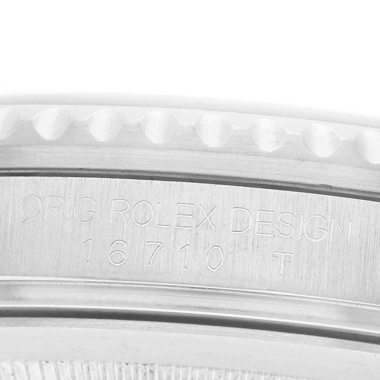 The image shows an angled close-up of the case side of a Rolex GMT-Master 16710 Men
s Stainless Steel Black Dial, highlighting the engraved model number.