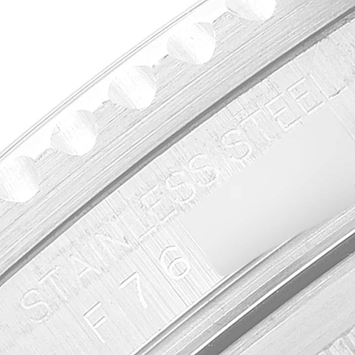 The image shows a close-up of the bezel edge and engraving on the side of the Rolex GMT-Master 16710 Men
s Stainless Steel Black Dial 16710 Men
s Stainless Steel Black Dial watch.