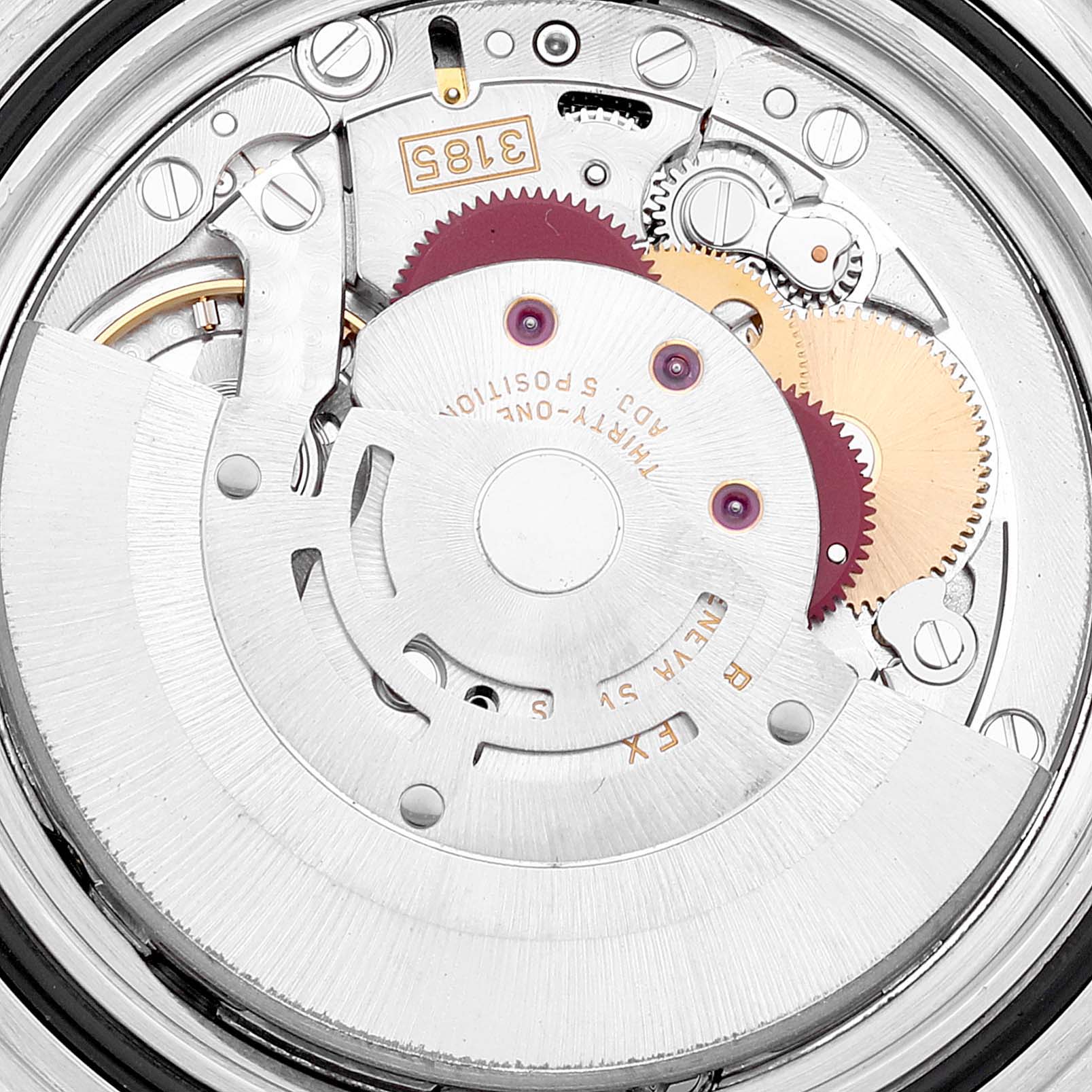 The image shows an internal view of the movement mechanism of a Rolex GMT-Master 16710 Men
s Stainless Steel Black Dial 16710 Men
s Stainless Steel Black Dial watch, featuring gears and components.