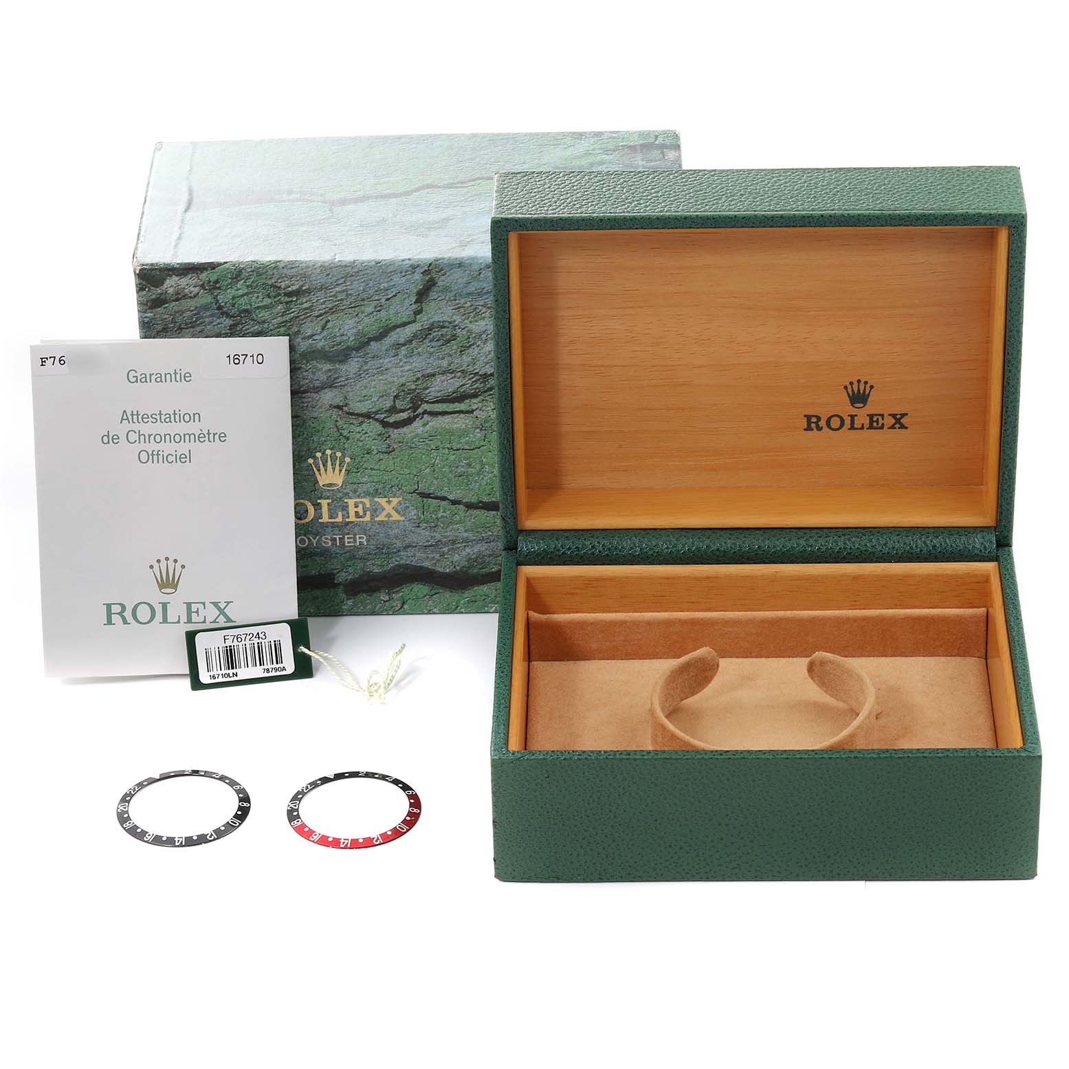 The image shows a green Rolex box for the GMT-Master model along with warranty papers and additional bezel inserts.
