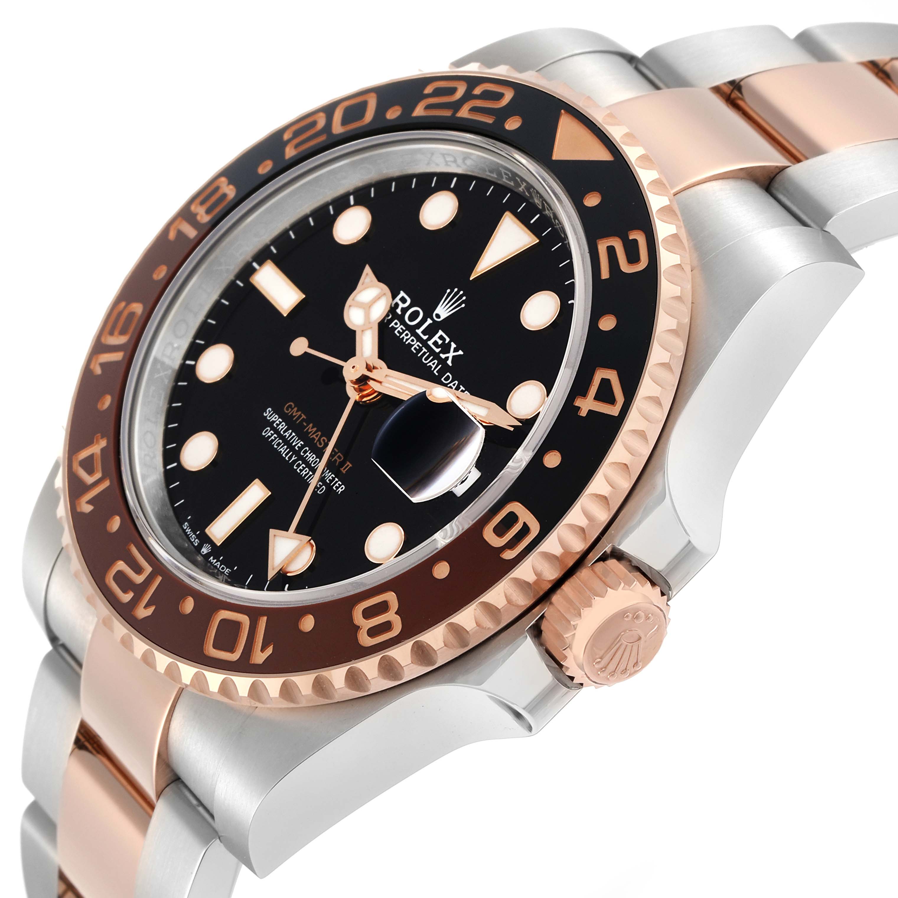 The image shows a Rolex GMT-Master 126711 Men
s Steel and Gold (two tone) Black Dial model at an angled view highlighting the bezel, crown, and part of the bracelet.