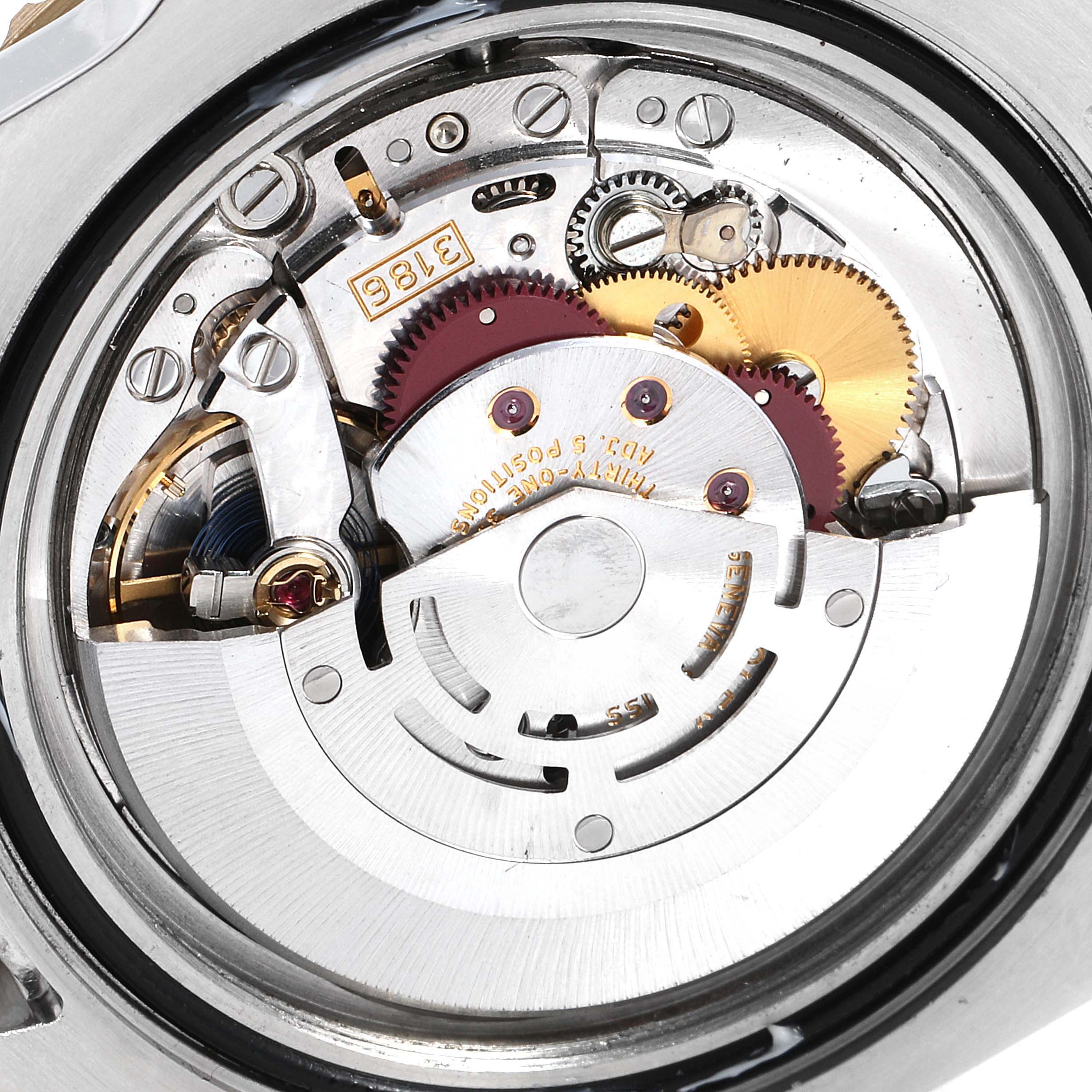 This image shows a close-up view of the movement mechanism of a Rolex GMT-Master 116713 Men's Steel and Gold (two tone) Black Dial 116713 Men's Steel and Gold (two tone) Black Dial watch.