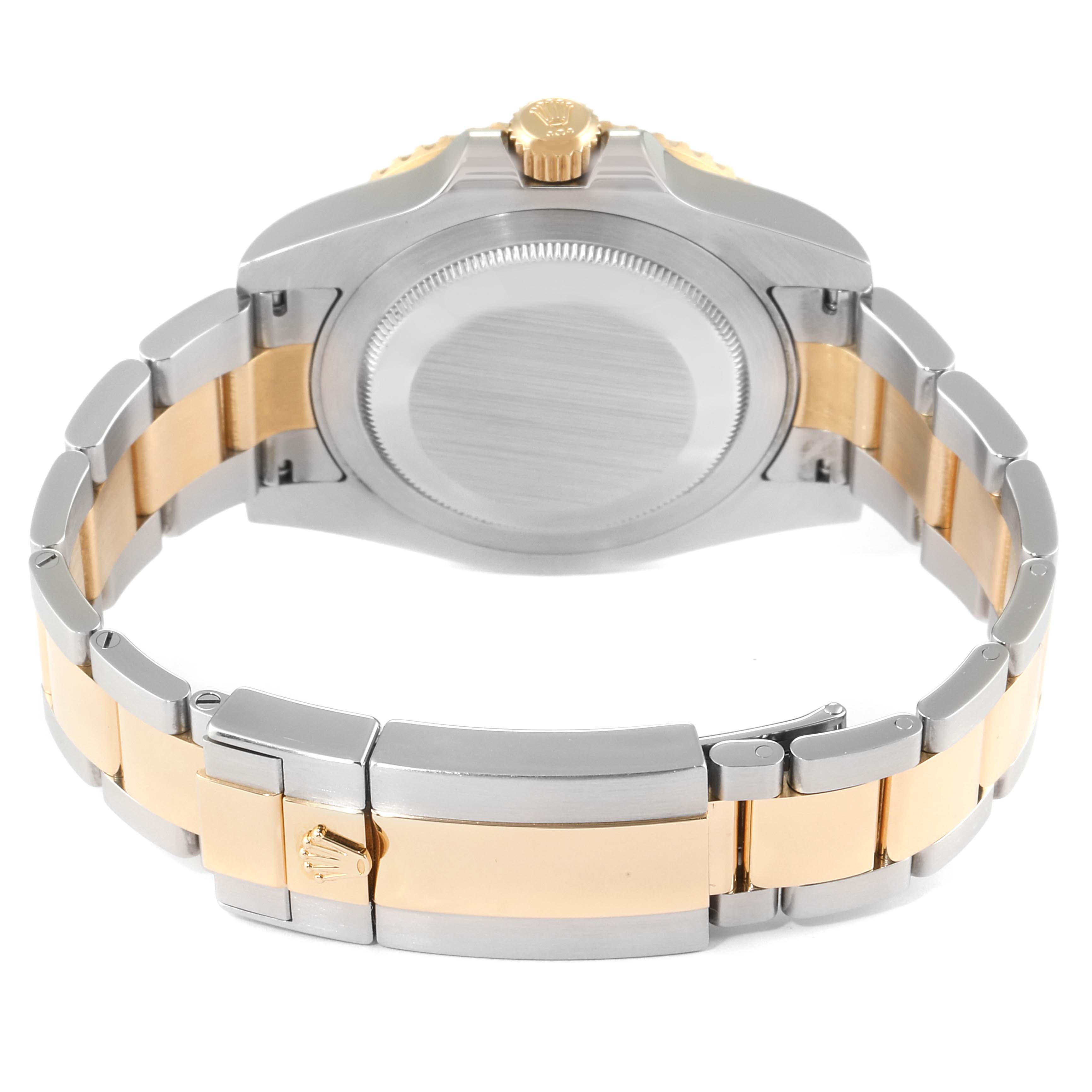 The image shows the back case, crown, and bi-metal bracelet of a Rolex GMT-Master 116713 Men
s Stainless Steel Black Dial 116713 Men
s Stainless Steel Black Dial watch.