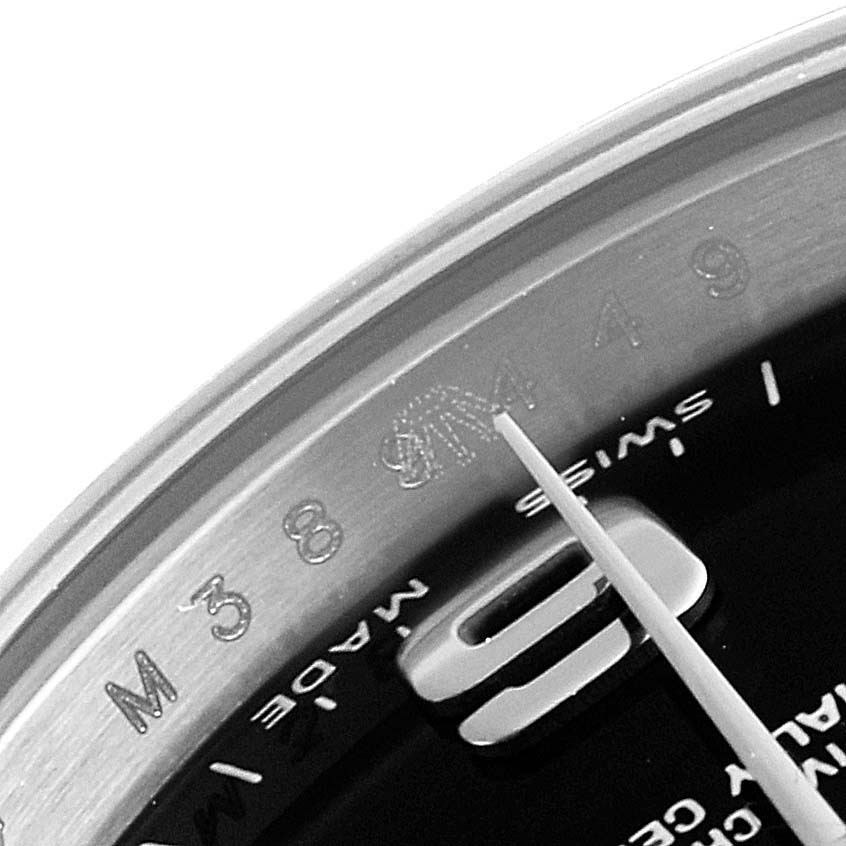 This close-up image of a Rolex Oyster Perpetual 176200 Women's Stainless Steel Black Dial 176200 Women's Stainless Steel Black Dial watch shows the dial and part of the bezel, with the numeral "9" and "Swiss Made" text.