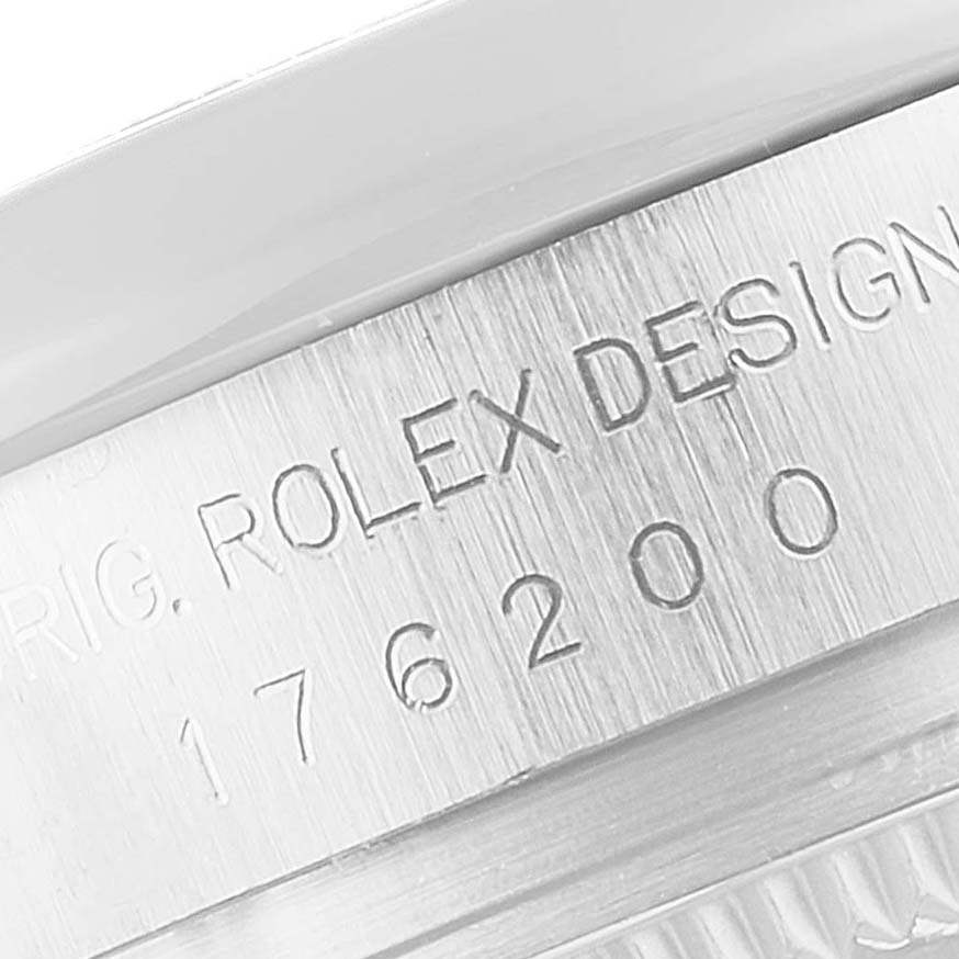 The image shows a close-up angle of the side engraving on a Rolex Oyster Perpetual 176200 Women's Stainless Steel Black Dial 176200 Women's Stainless Steel Black Dial watch.