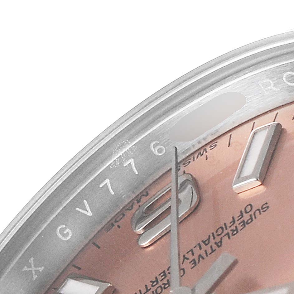 This image shows a close-up of the dial, indices, and part of the bezel of the Rolex Oyster Perpetual 176200 Women
s Stainless Steel Pink Dial 176200 Women
s Stainless Steel Pink Dial watch.