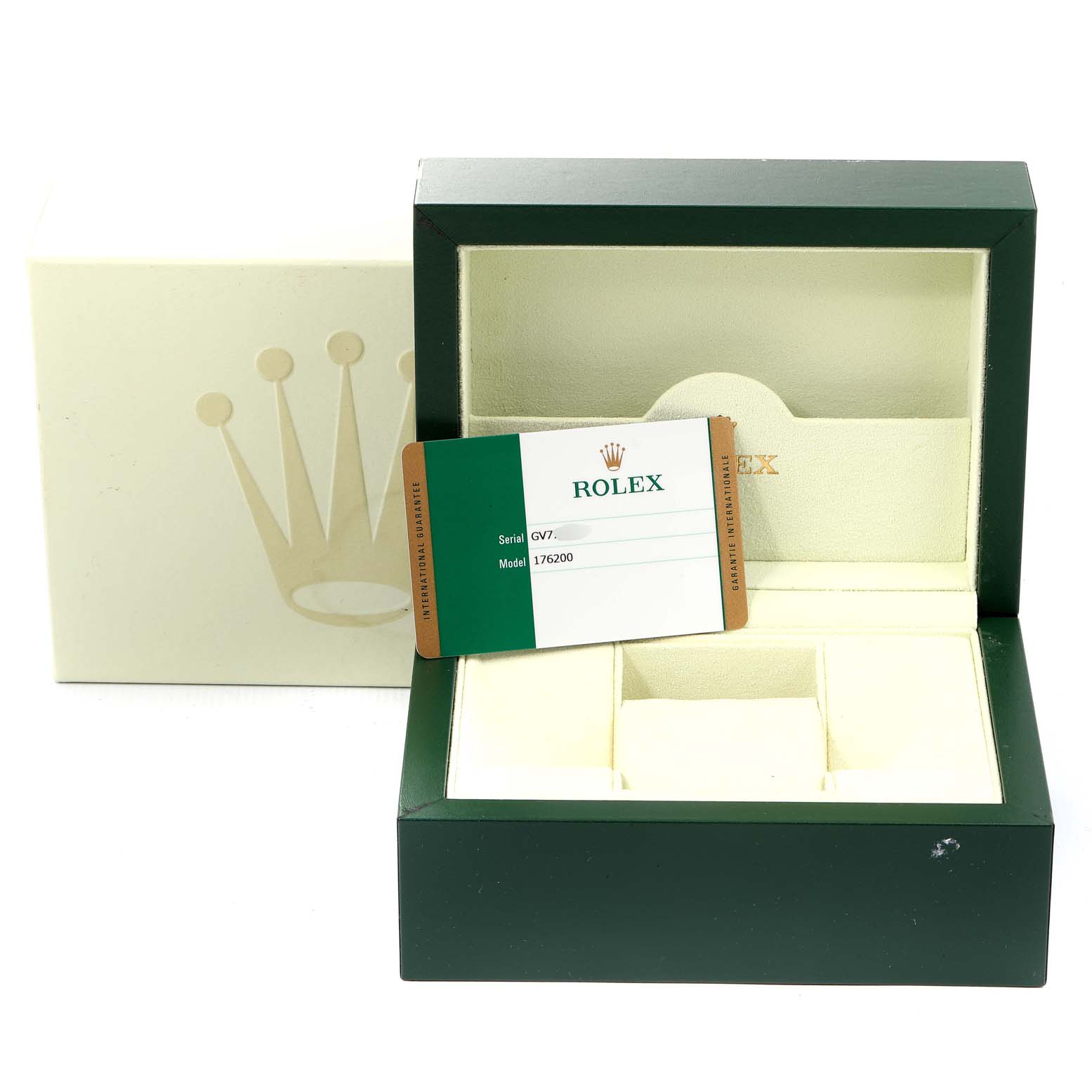 The image shows an open Rolex box for the Oyster Perpetual model, including the watch
s warranty card and outer box.