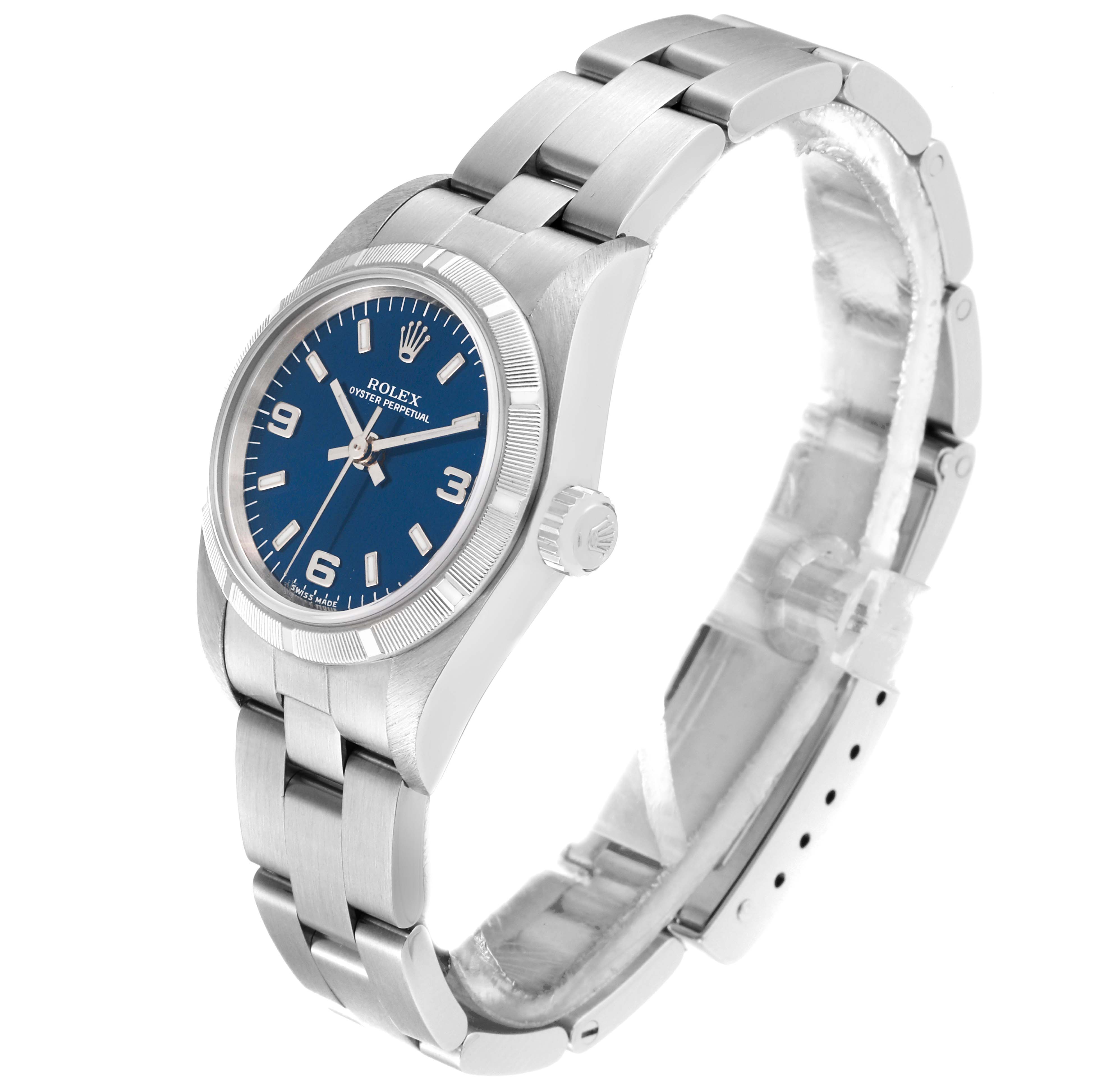 The image shows a side-front angle of the Rolex Oyster Perpetual 76030 Women's Stainless Steel Blue Dial 76030 Women's Stainless Steel Blue Dial watch, highlighting the blue dial, bezel, crown, and bracelet.