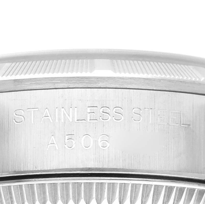 This is a close-up of the stainless steel case back of a Rolex Oyster Perpetual 76030 Women's Stainless Steel Blue Dial 76030 Women's Stainless Steel Blue Dial watch.