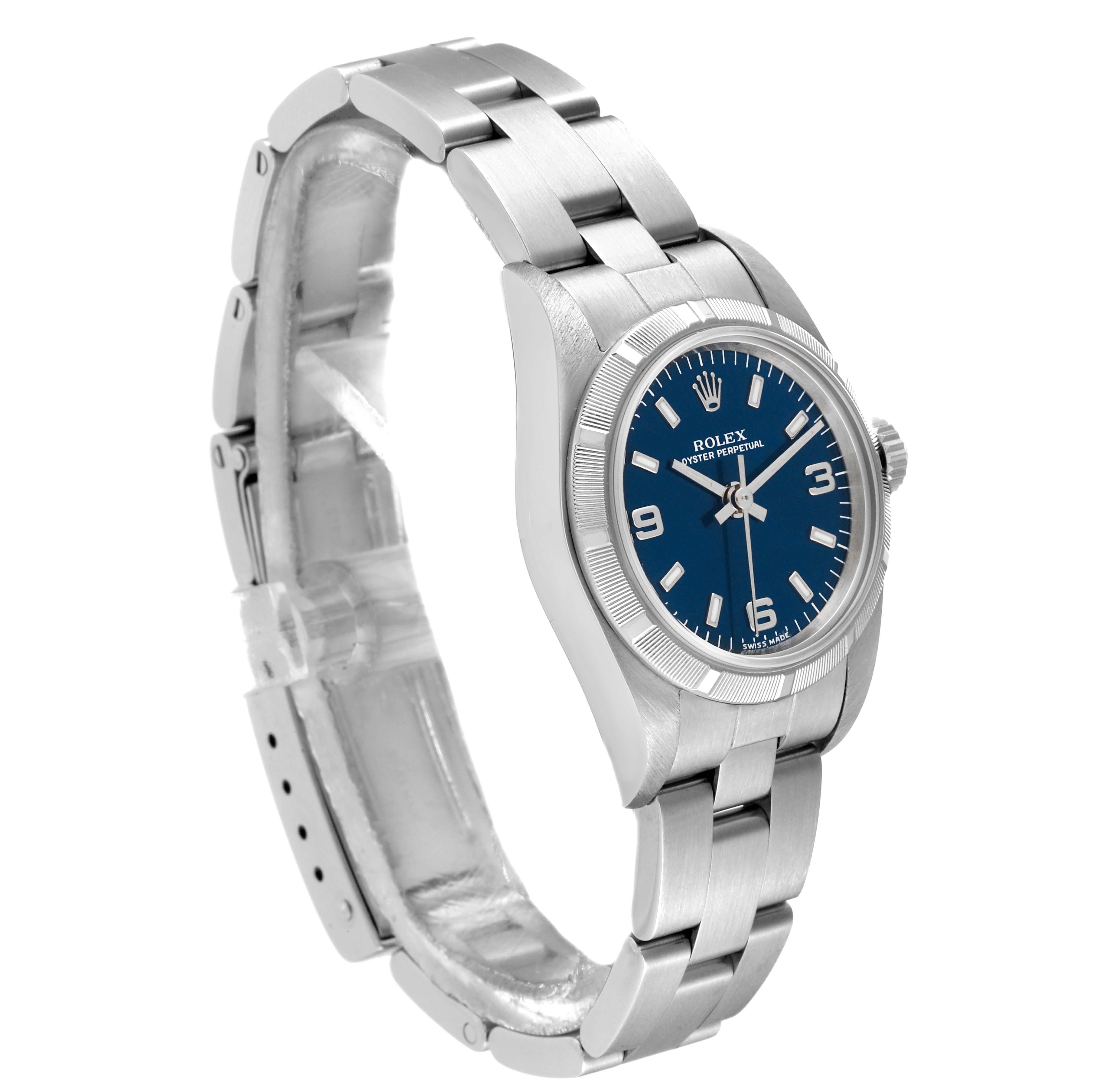 The Rolex Oyster Perpetual 76030 Women's Stainless Steel Blue Dial 76030 Women's Stainless Steel Blue Dial watch is shown at an angled side view, displaying the bracelet, case, and blue dial.