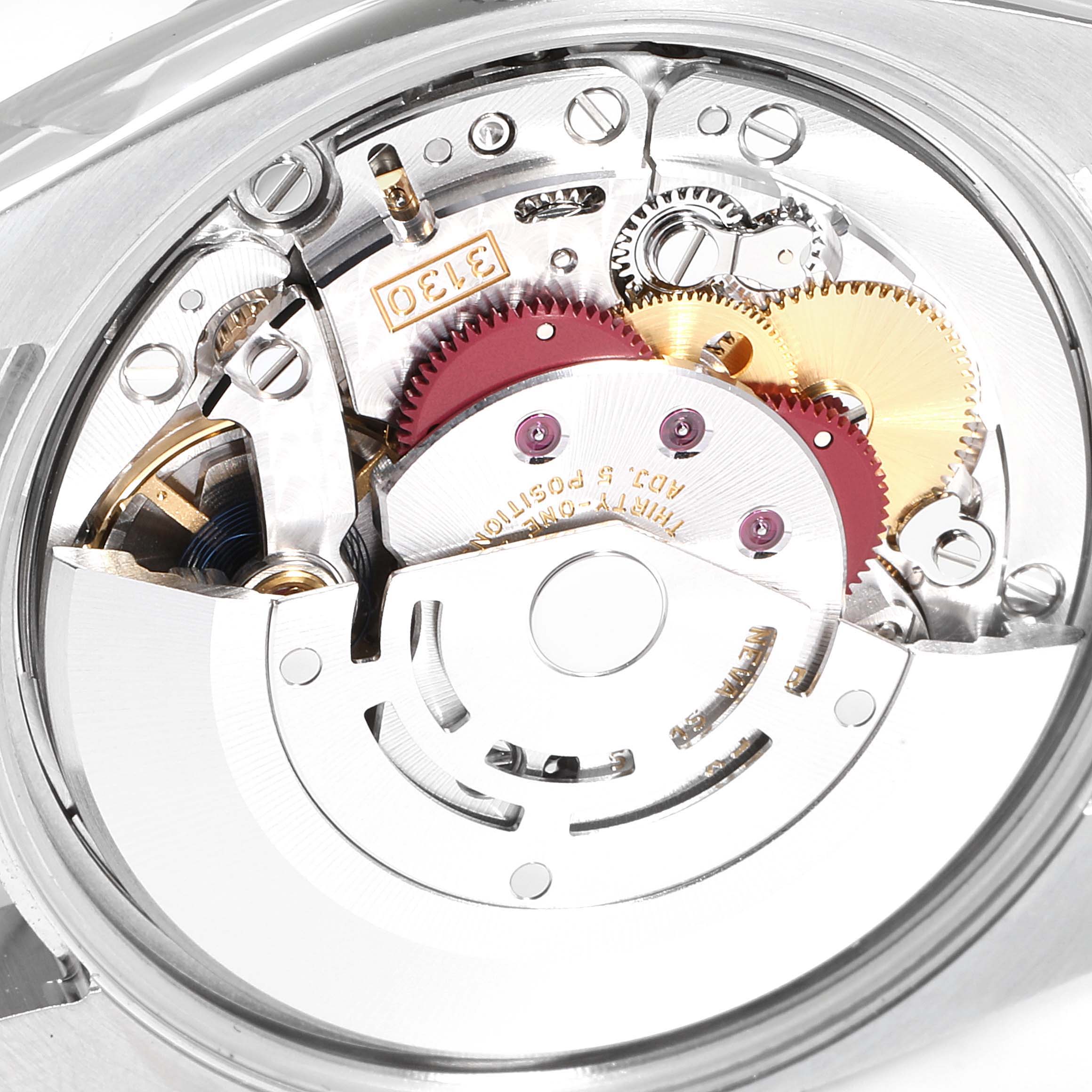 This is a close-up view of the movement and inner components of a Rolex Oyster Perpetual 114200 Men's Stainless Steel Silver Dial 114200 Men's Stainless Steel Silver Dial watch.