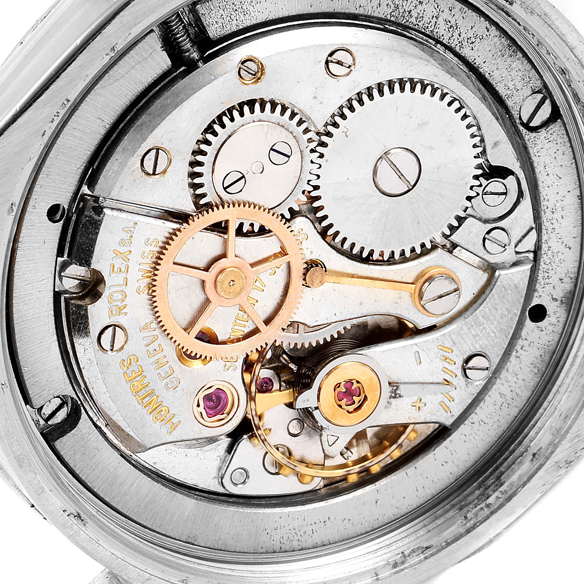 The image shows the internal mechanism of a Rolex Date 6694 Men's Stainless Steel Black Dial 6694 Men's Stainless Steel Black Dial model watch, highlighting its gears and springs.