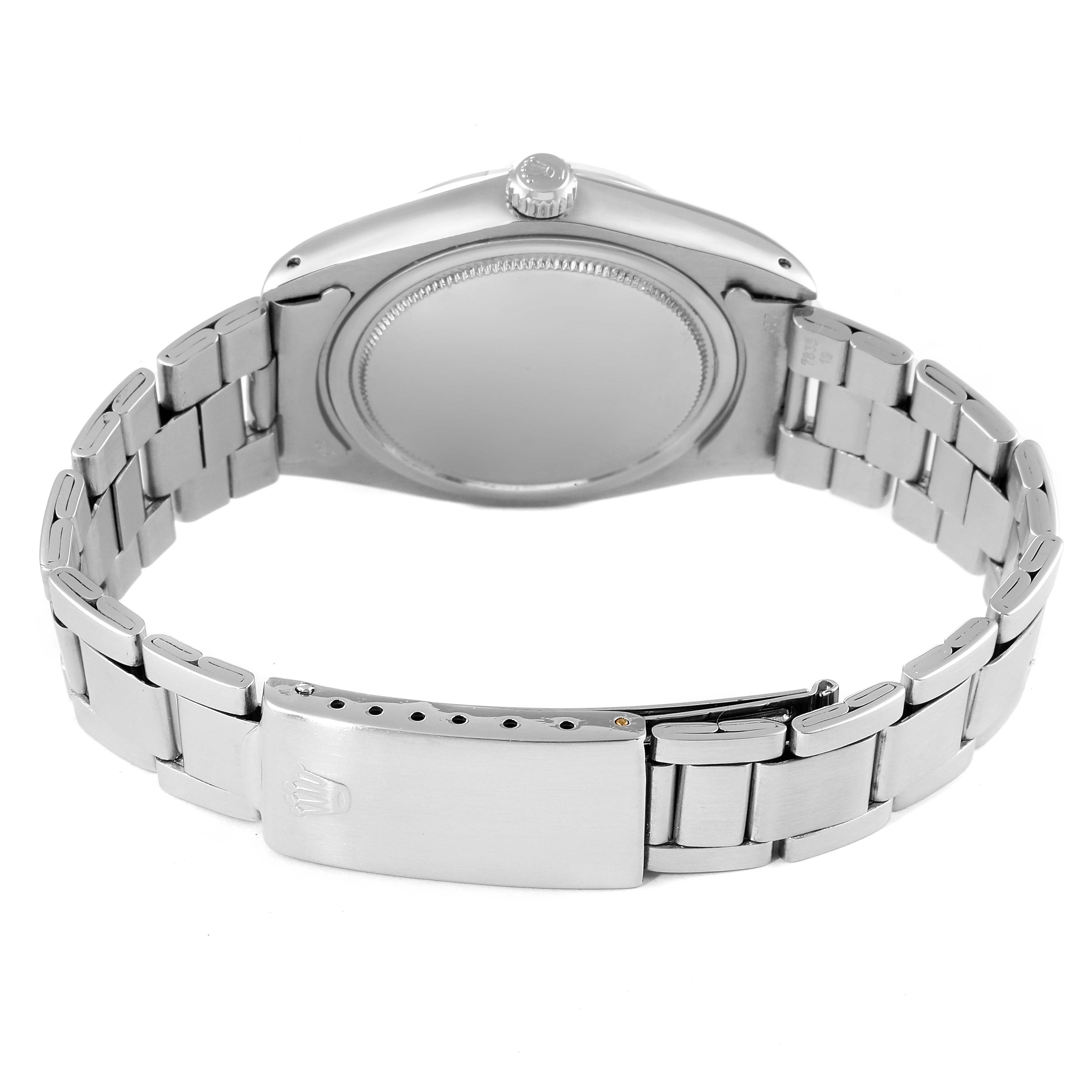 The image shows the back case, crown, and bracelet clasp of the Rolex Date 6694 Men's Stainless Steel Silver Dial 6694 Men's Stainless Steel Silver Dial model watch from a rear angle.