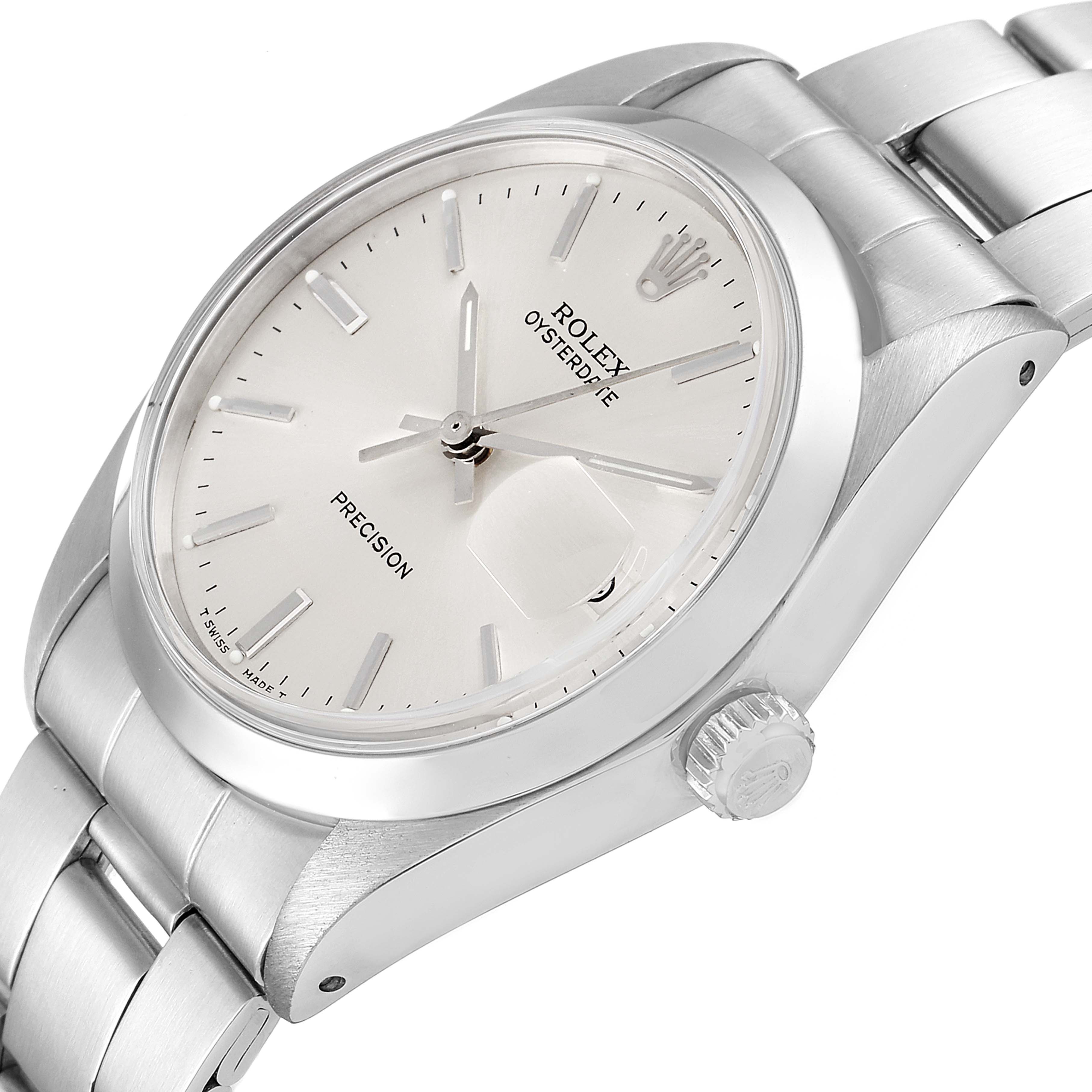 The image shows a side angle view of a Rolex Date 6694 Men's Stainless Steel Silver Dial 6694 Men's Stainless Steel Silver Dial model watch, highlighting its dial, crown, and stainless steel bracelet.