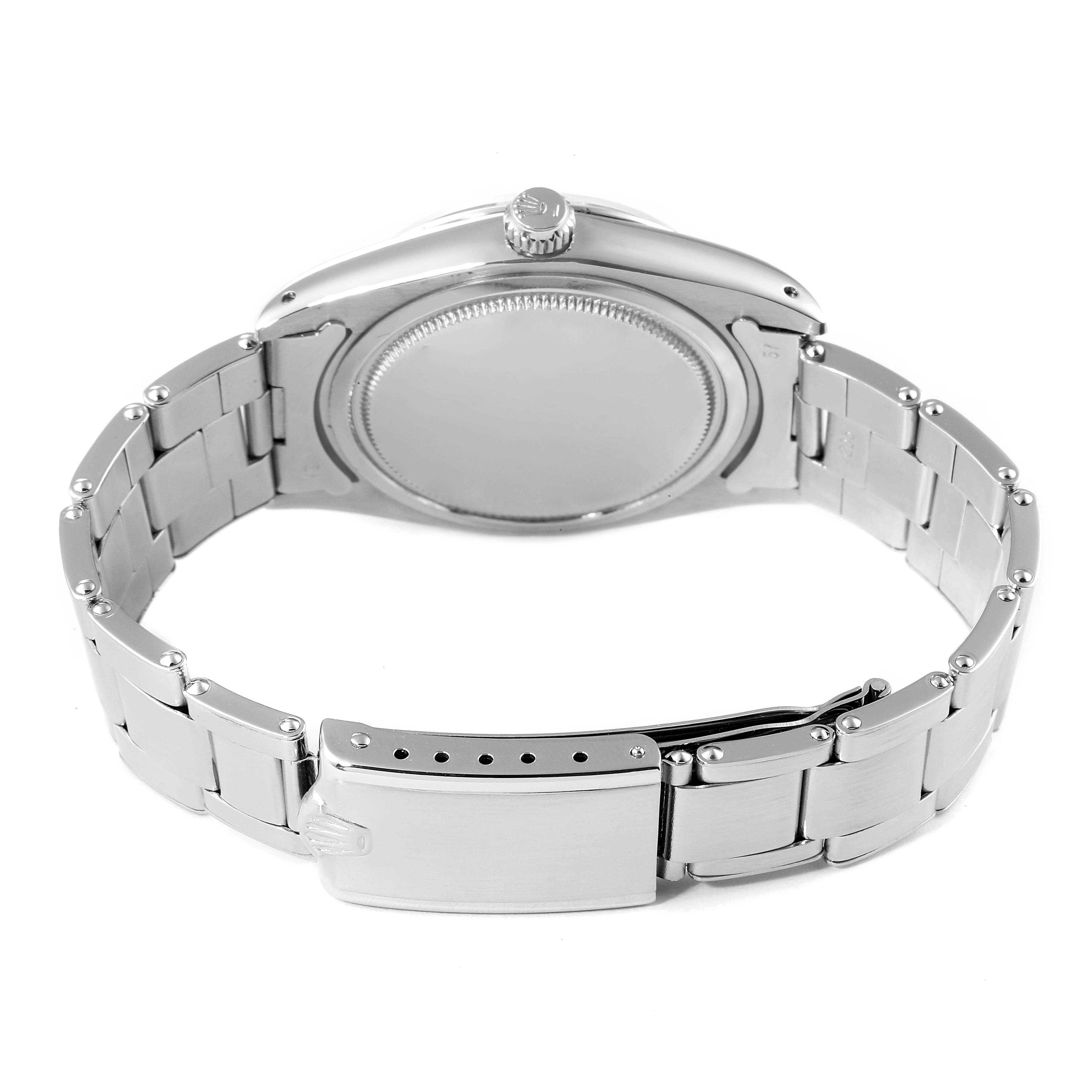 The image shows the rear case, crown, and stainless steel bracelet of the Rolex Vintage Collection 6694 Men's Stainless Steel Silver Dial 6694 Men's Stainless Steel Silver Dial watch.