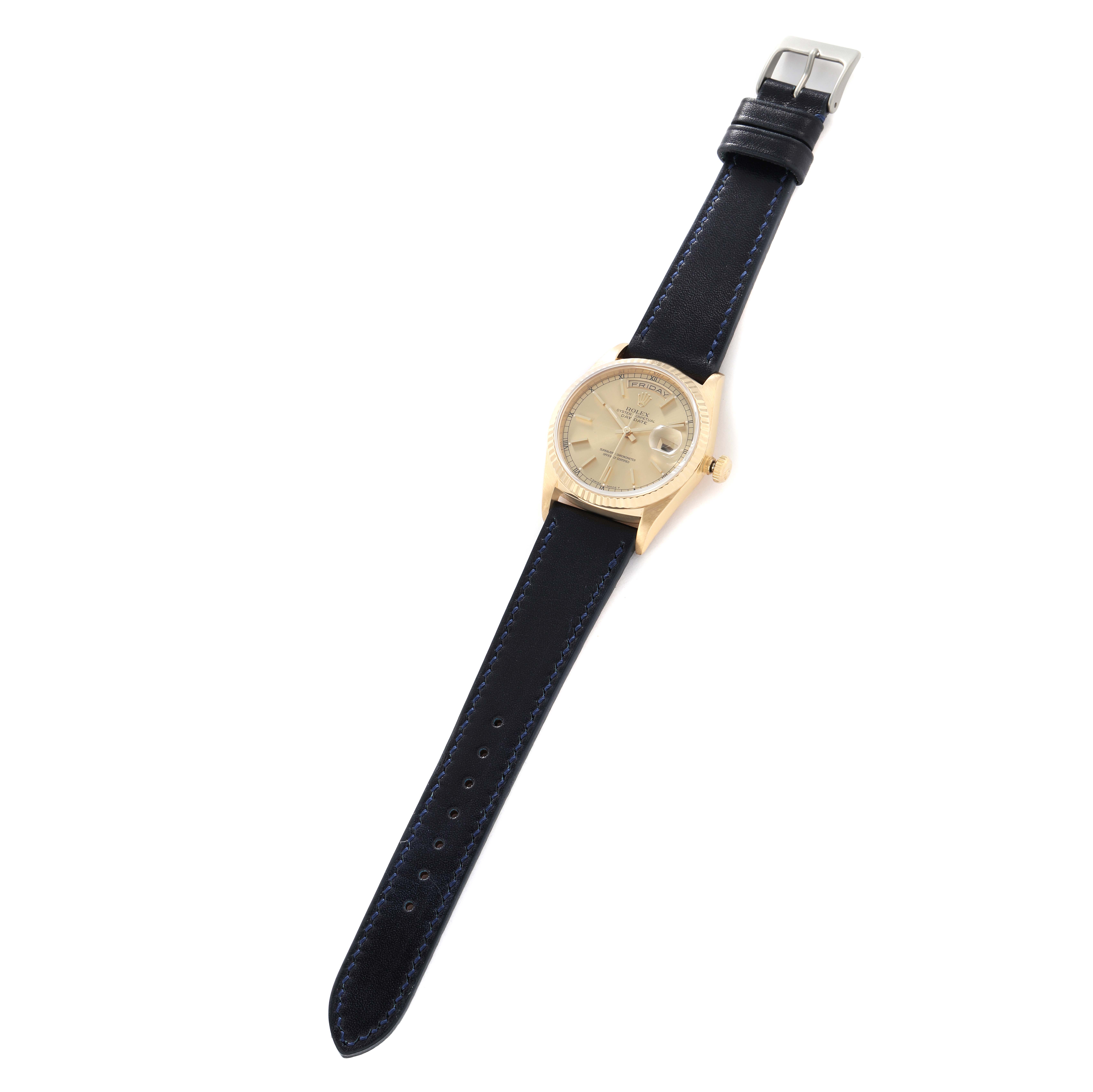 The Rolex President 18238 Men
s Yellow Gold Champagne Dial watch is shown from a top-down angle, displaying the full face, bezel, case, strap, and buckle.