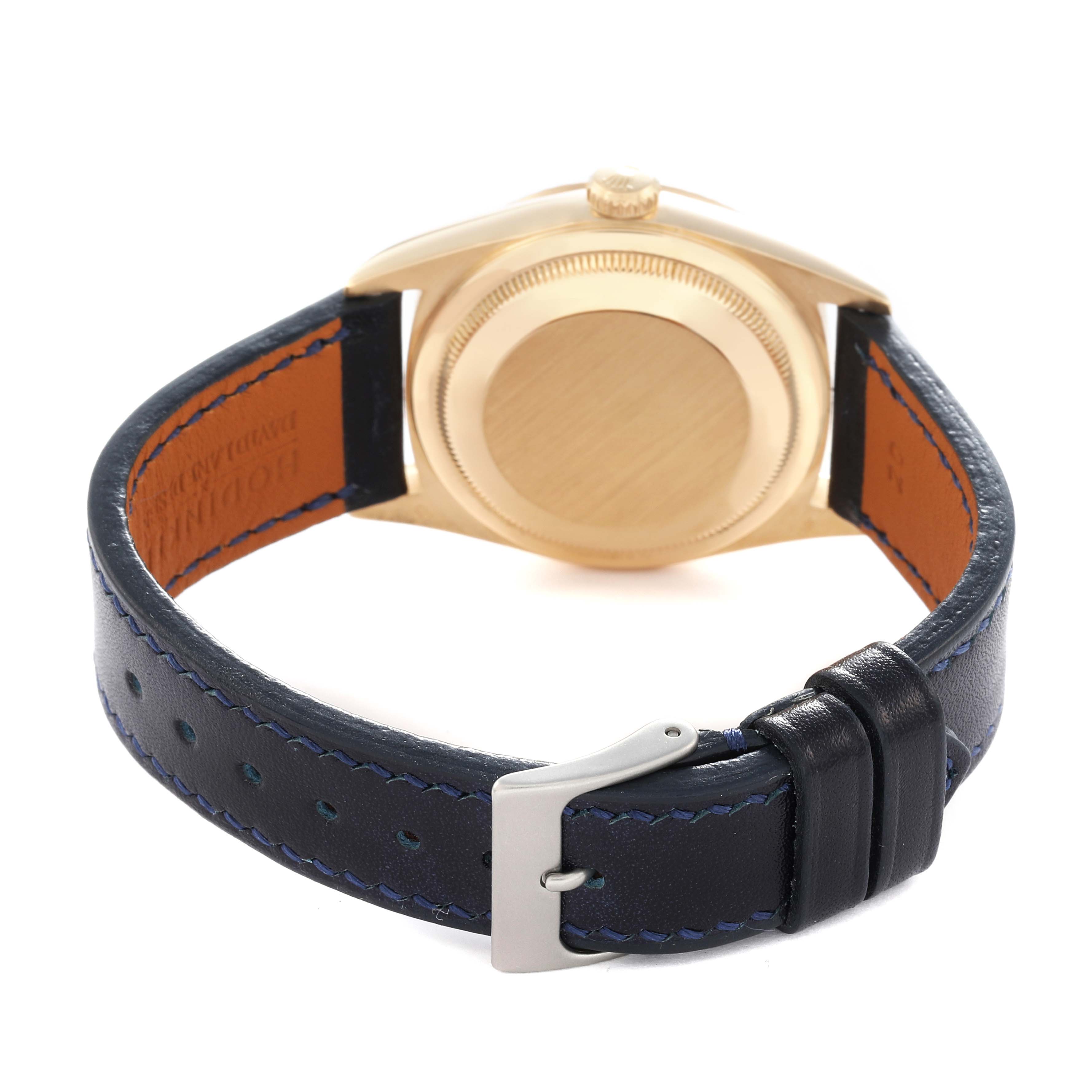 The Rolex President 18238 Men
s Yellow Gold Champagne Dial model is shown from the back, highlighting the watch
s case, crown, and leather strap with buckle.