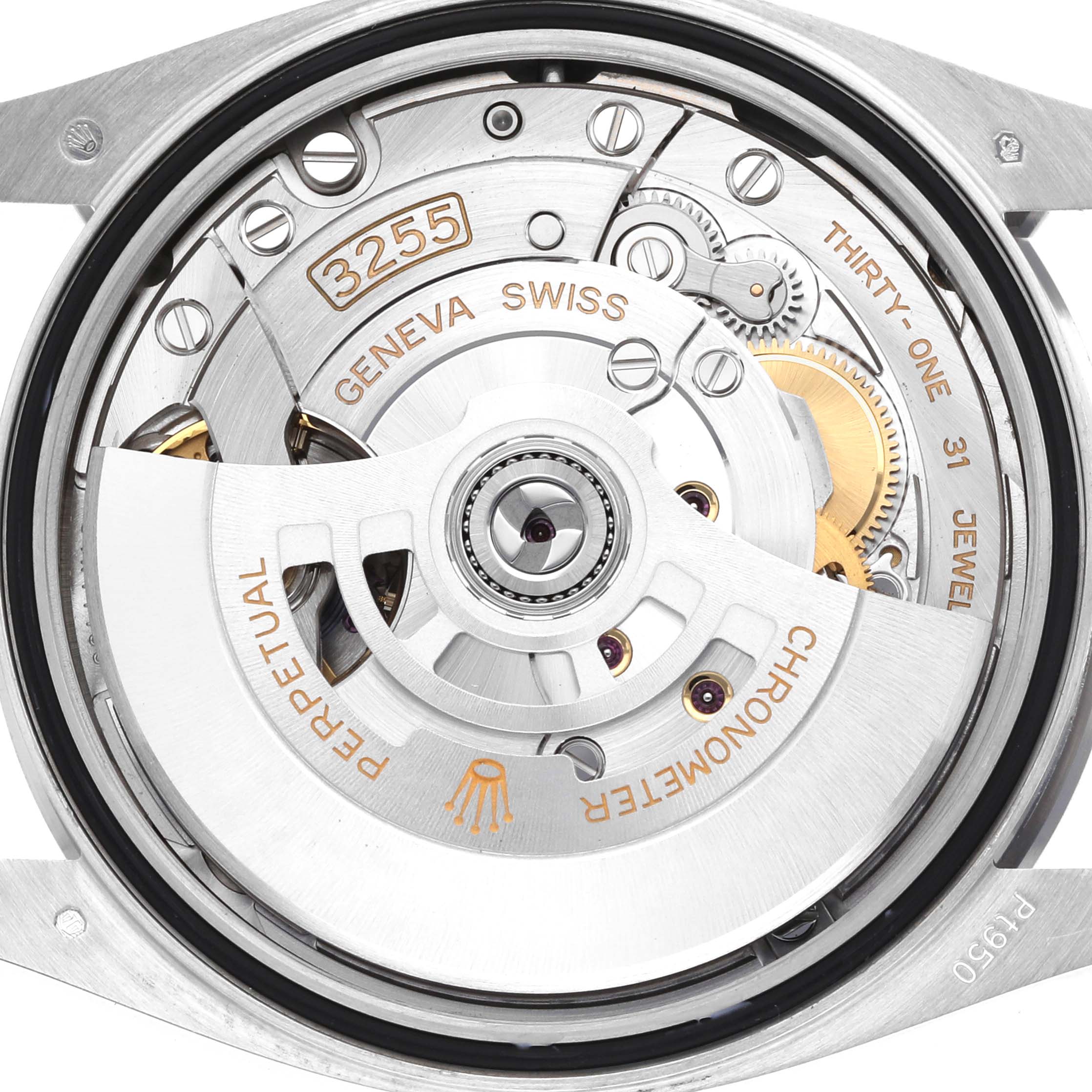 The image shows the movement of a Rolex President 128236 Men
s Platinum Blue Dial model, highlighting the intricate mechanical components and engravings.
