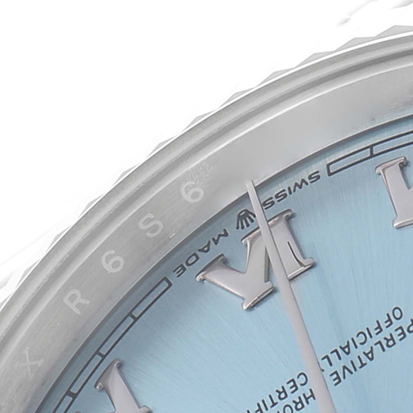 The image shows the upper part of the dial and bezel of a Rolex President 128236 Men
s Platinum Blue Dial watch at a slight angle.