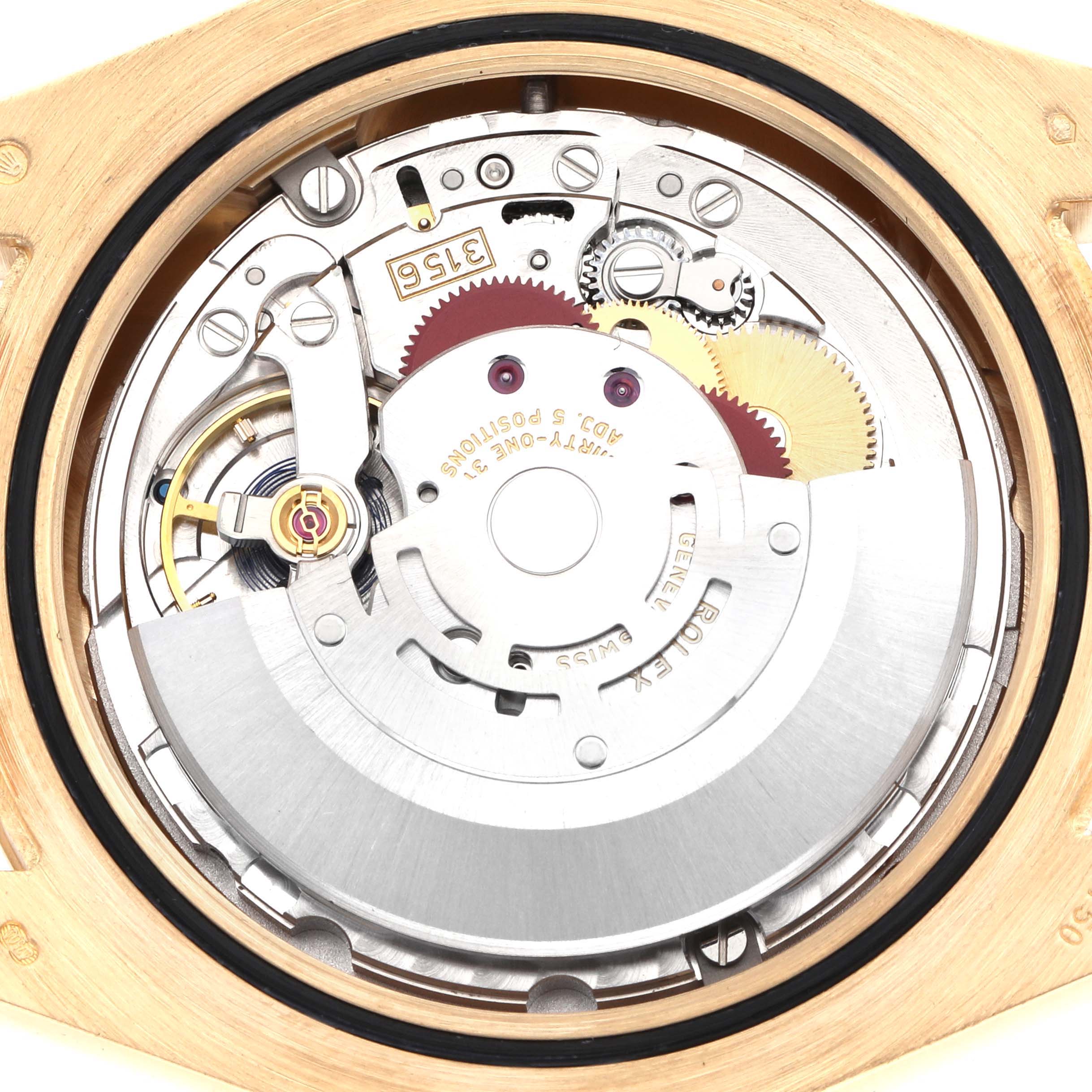The image shows the back of a Rolex Daytona 218238 Men
s Yellow Gold Champagne Dial watch, displaying its mechanical movement and intricate internal components.
