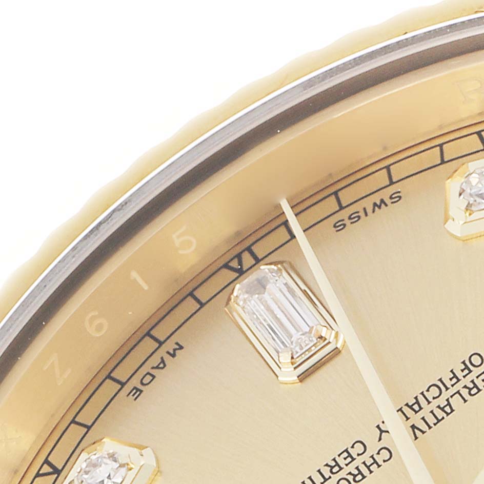 The close-up image shows part of the dial and bezel of the Rolex Daytona 218238 Men
s Yellow Gold Champagne Dial, highlighting the hour markers and inscriptions.