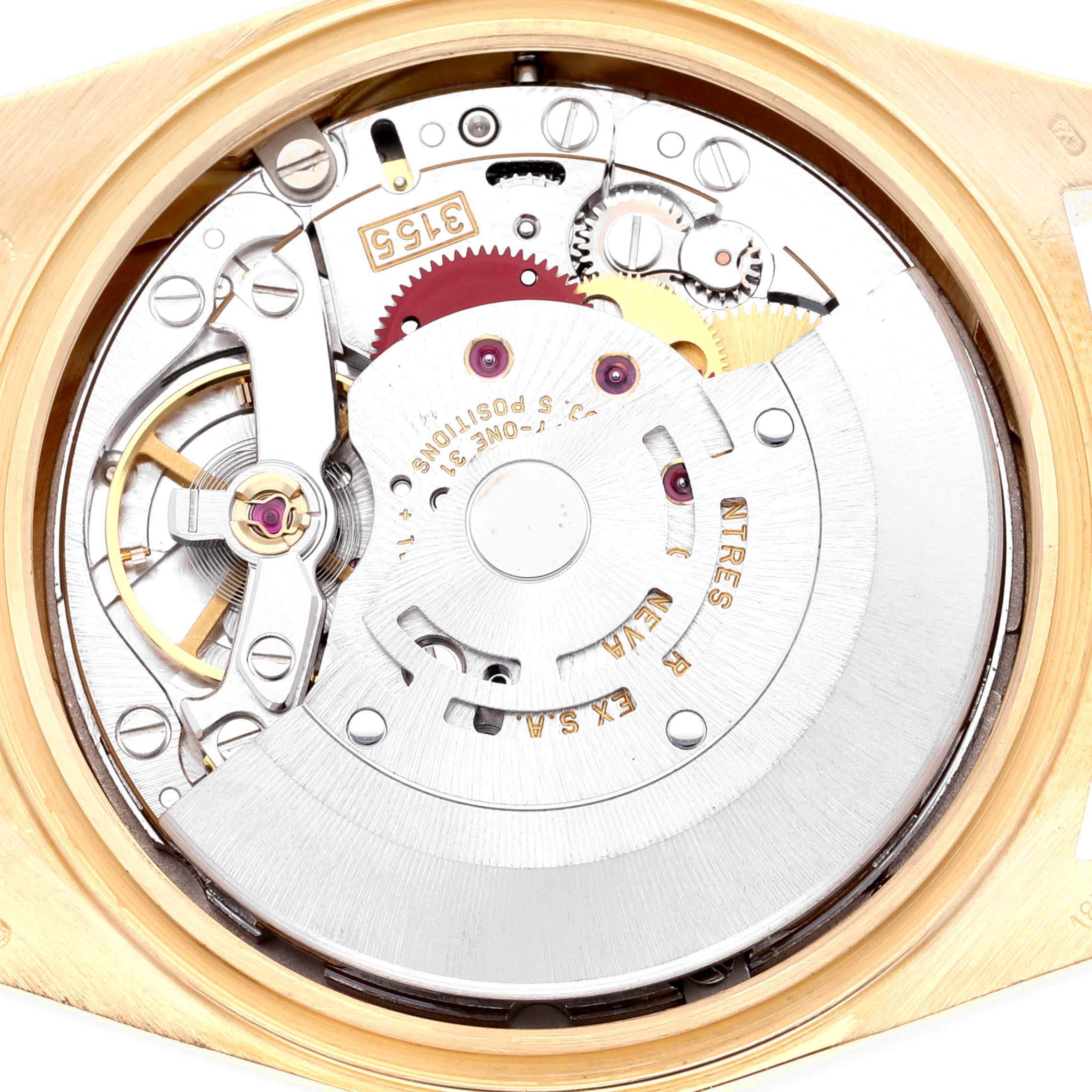The image shows the internal movement of a Rolex President 18308 Men's Yellow Gold Champagne Dial 18308 Men's Yellow Gold Champagne Dial model watch, featuring gears and mechanical components.