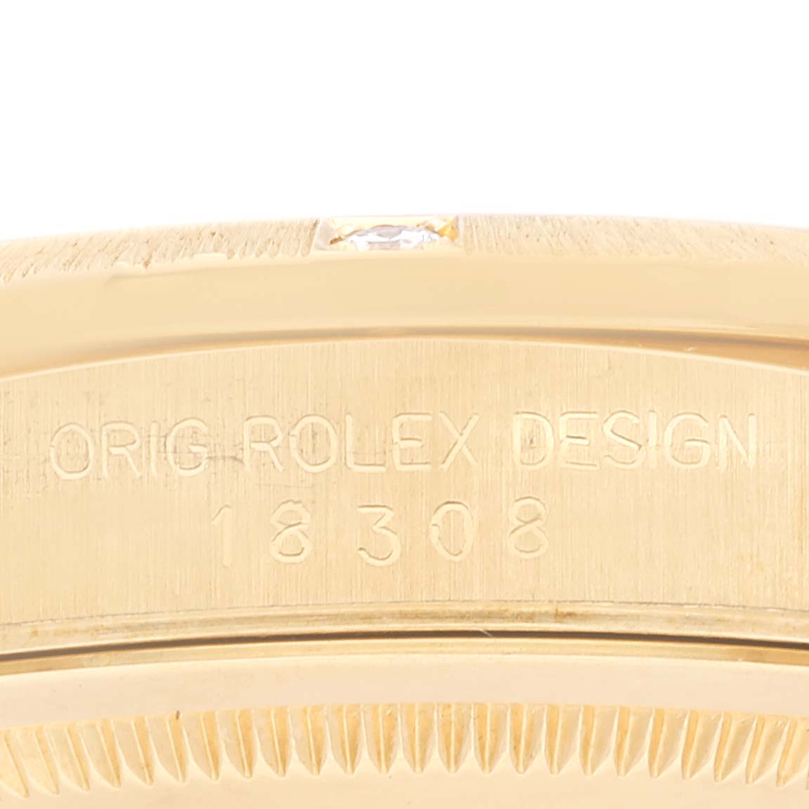 The image shows a close-up view of the case side engraving on a Rolex President 18308 Men's Yellow Gold Champagne Dial 18308 Men's Yellow Gold Champagne Dial model watch.