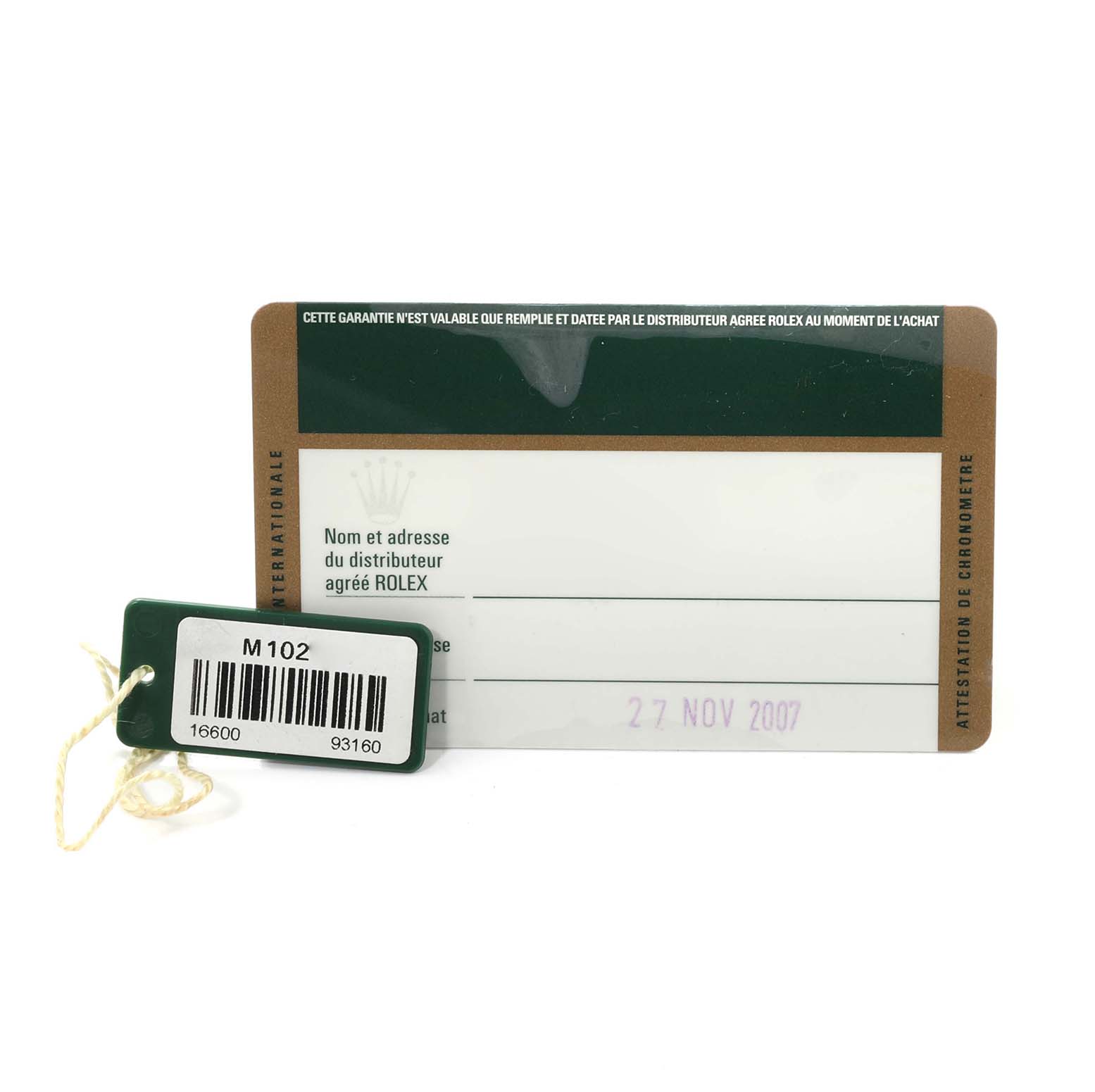 The image shows the International Warranty Card and a barcode tag for the Rolex Sea-Dweller 16600 Men
s Stainless Steel Black Dial 16600 Men
s Stainless Steel Black Dial watch model.