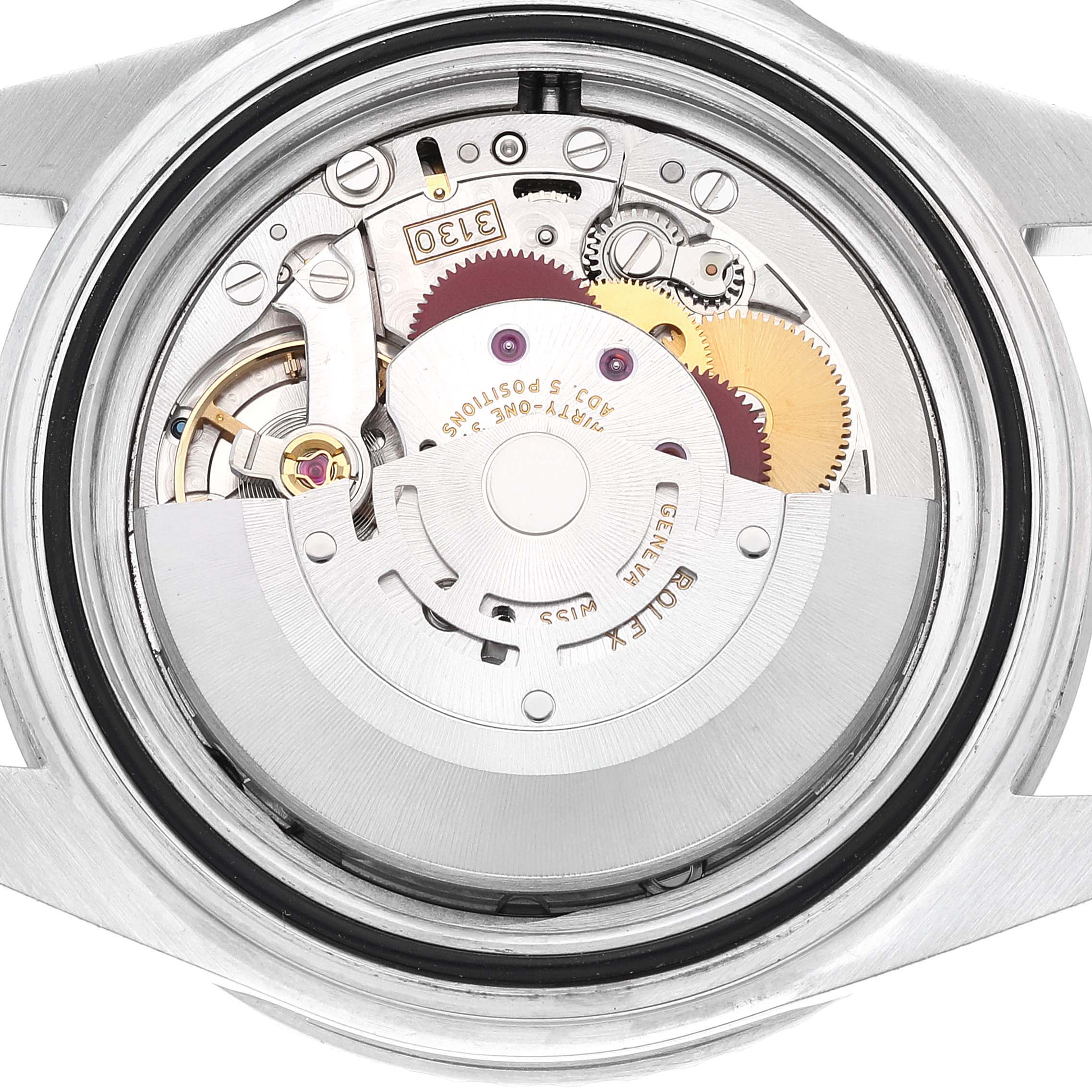 This image shows the movement and internal components of a Rolex Submariner 14060M Men
s Stainless Steel Black Dial 14060M Men
s Stainless Steel Black Dial watch from a back angle with the case back removed.