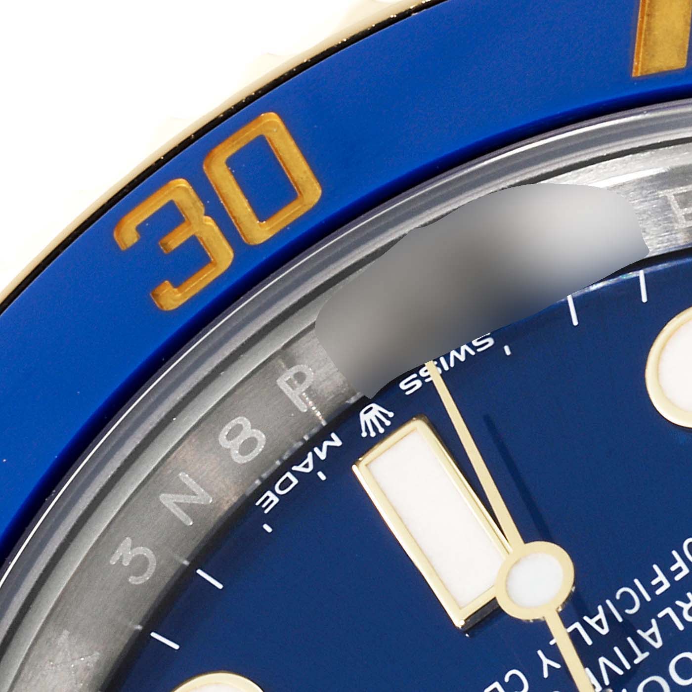 The image shows a close-up of the dial and bezel of a Rolex Submariner 126613 Men
s Steel and Gold (two tone) Blue Dial 126613 Men
s Steel and Gold (two tone) Blue Dial, highlighting the 30-minute mark and "Swiss Made" on the face.