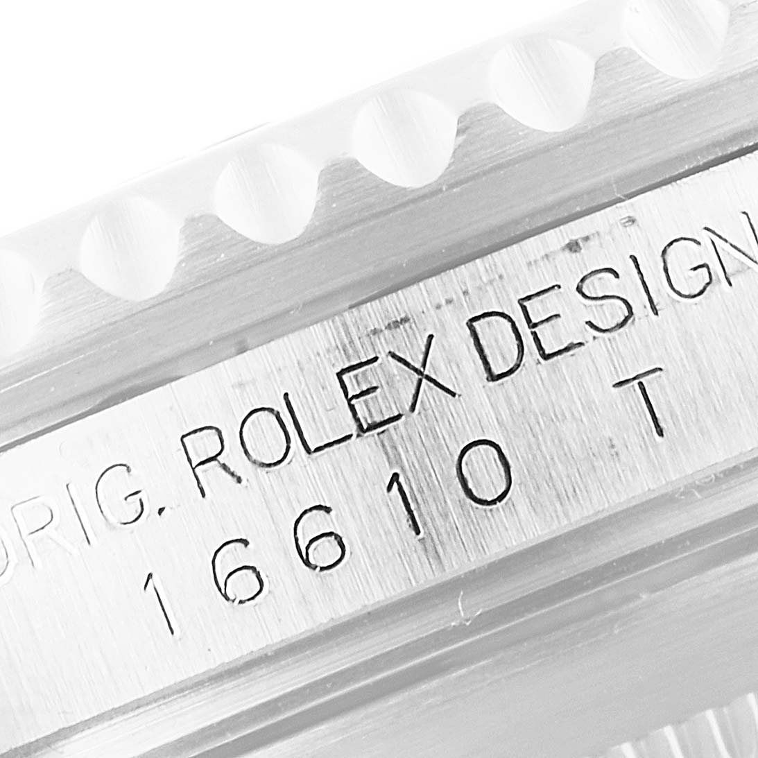 The image shows a close-up of the casing side of a Rolex Submariner 16610 Men
s Stainless Steel Black Dial 16610 Men
s Stainless Steel Black Dial watch with the model number 16610 engraved.
