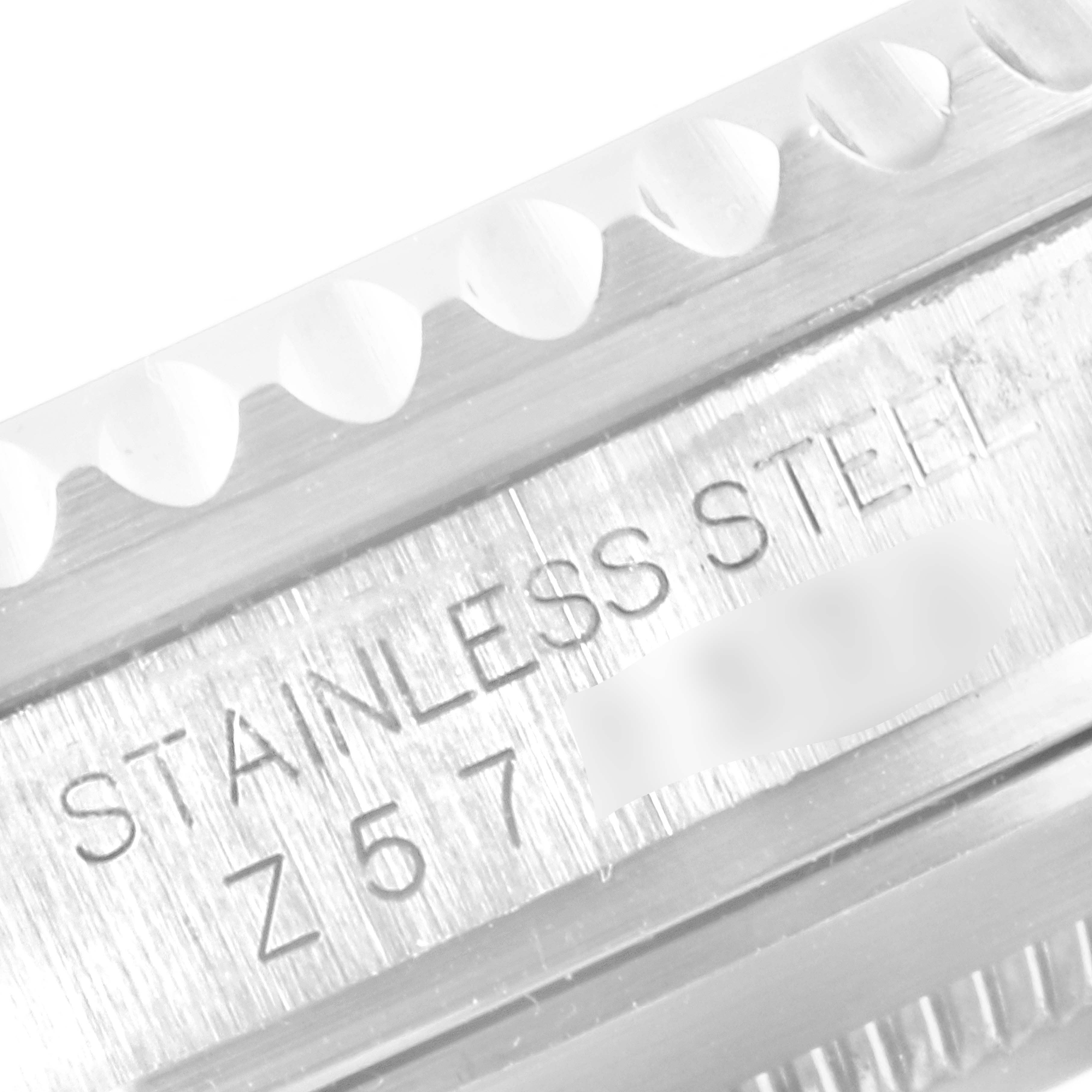 The image shows a close-up of the bezel and engraving on a stainless steel Rolex Submariner 16610 Men
s Stainless Steel Black Dial 16610 Men
s Stainless Steel Black Dial watch.