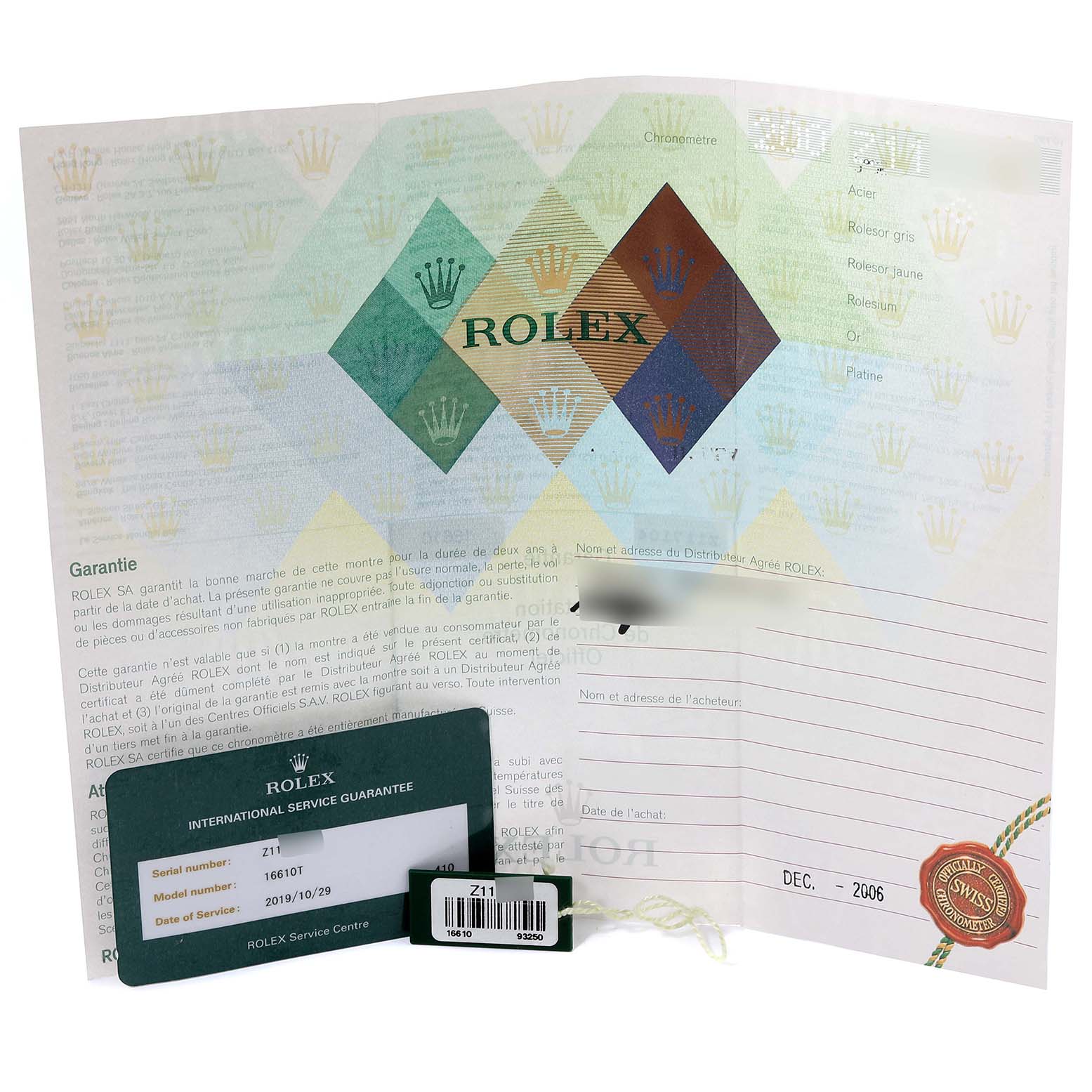 The image shows the warranty card, tag, and paperwork for a Rolex Submariner 16610 Men
s Stainless Steel Black Dial 16610 Men
s Stainless Steel Black Dial watch, displayed from a front angle.