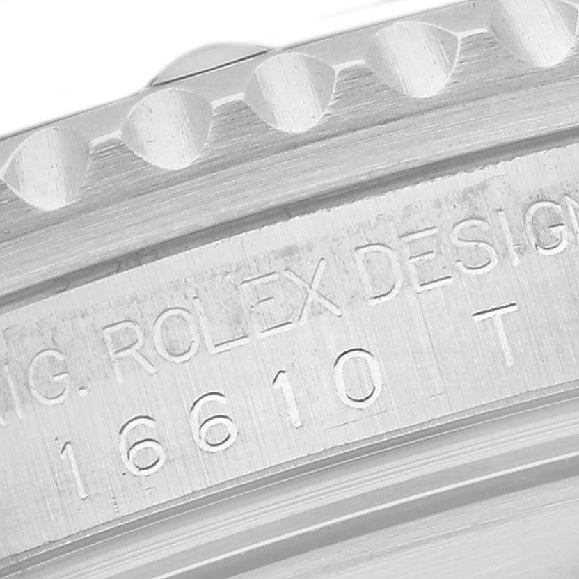 The image shows a close-up angle of the case
s side of a Rolex Submariner 16610 Men
s Stainless Steel Black Dial 16610 Men
s Stainless Steel Black Dial watch, displaying the engraved model number.