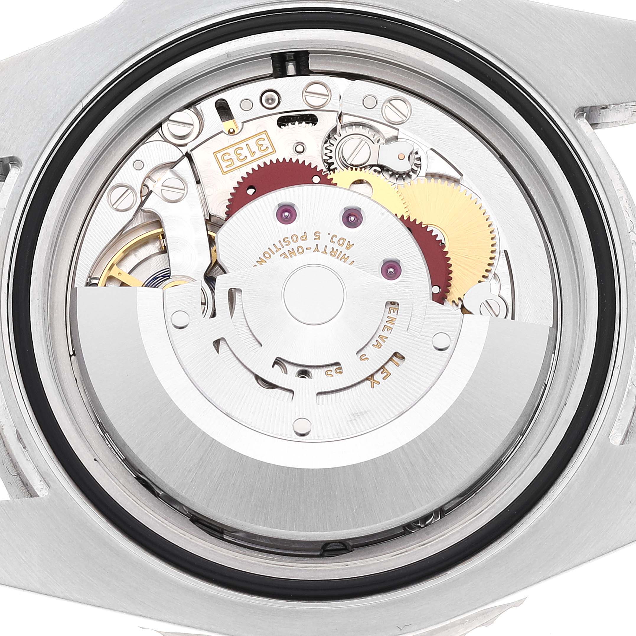 This image shows the opened case back of a Rolex Submariner 116610LV Men
s Stainless Steel Green Dial 116610LV Men
s Stainless Steel Green Dial model, revealing its intricate automatic movement mechanism.