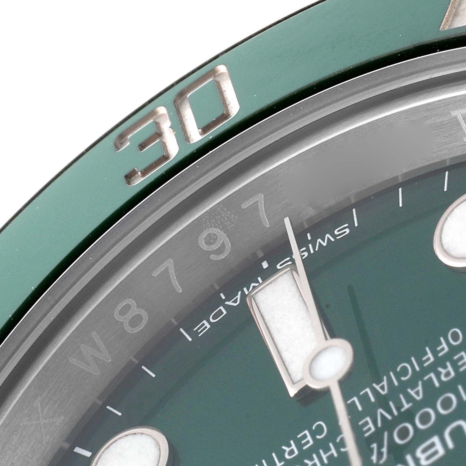 This close-up image shows the dial, indices, and part of the bezel of a Rolex Submariner 116610LV Men
s Stainless Steel Green Dial 116610LV Men
s Stainless Steel Green Dial watch.