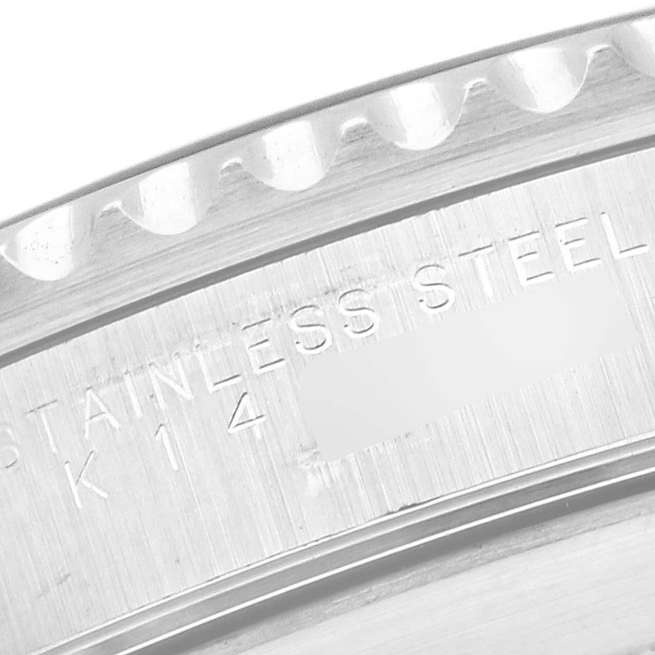 This image shows a close-up of the case back edge and engraved text of a Rolex Submariner 14060M Men's Stainless Steel Black Dial 14060M Men's Stainless Steel Black Dial watch.