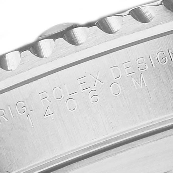This image shows a close-up of the side of a Rolex Submariner 14060M Men
s Stainless Steel Black Dial 14060M Men
s Stainless Steel Black Dial, focusing on the engraved text.